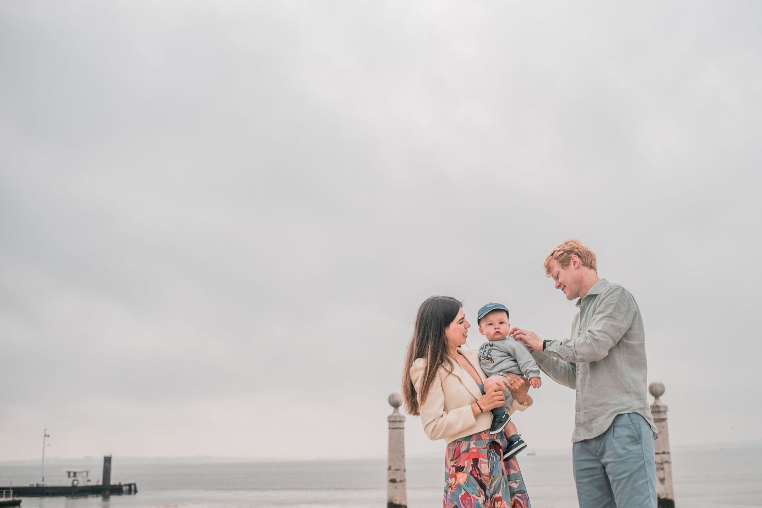 Parents and children sharing a joyful moment during a family session in Lisbon.