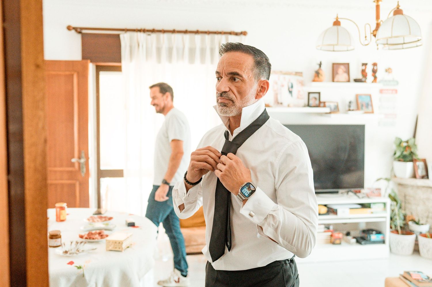 Elegant groom during destination wedding preparations in Cascais, Portugal.