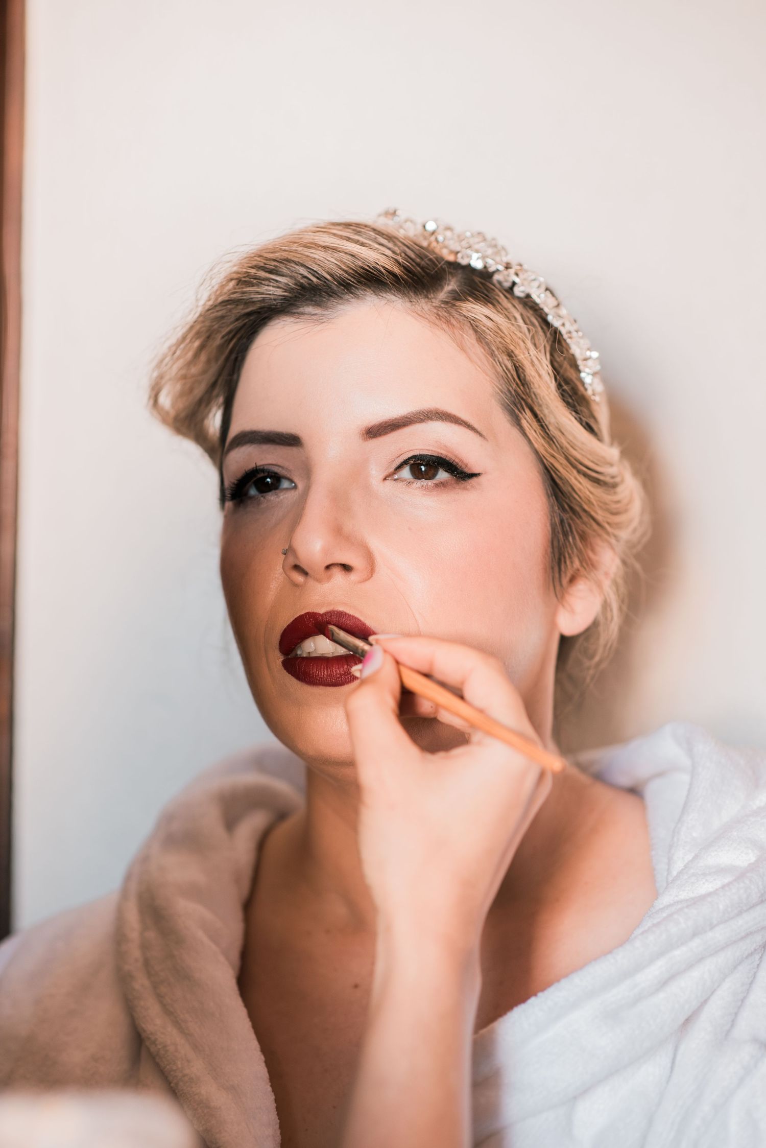 Elegant bride during destination wedding preparations in Óbidos, Portugal.