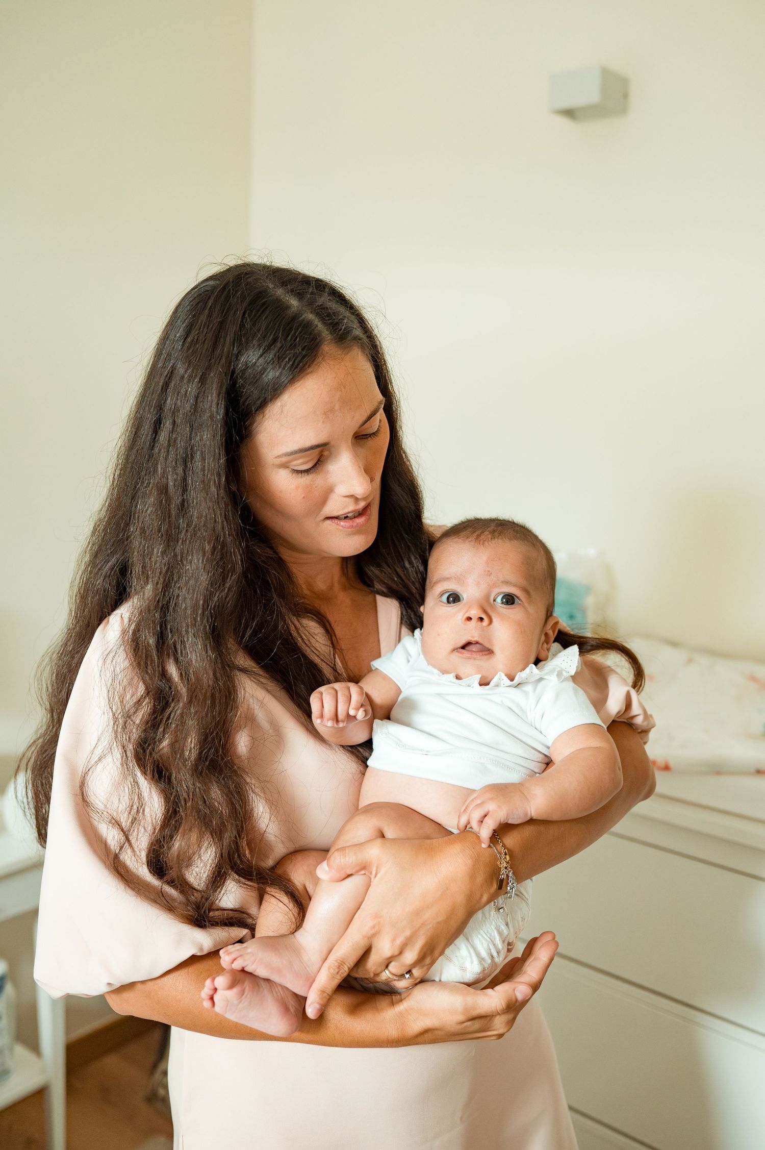 Baby baptism photography capturing natural and heartfelt family moments.