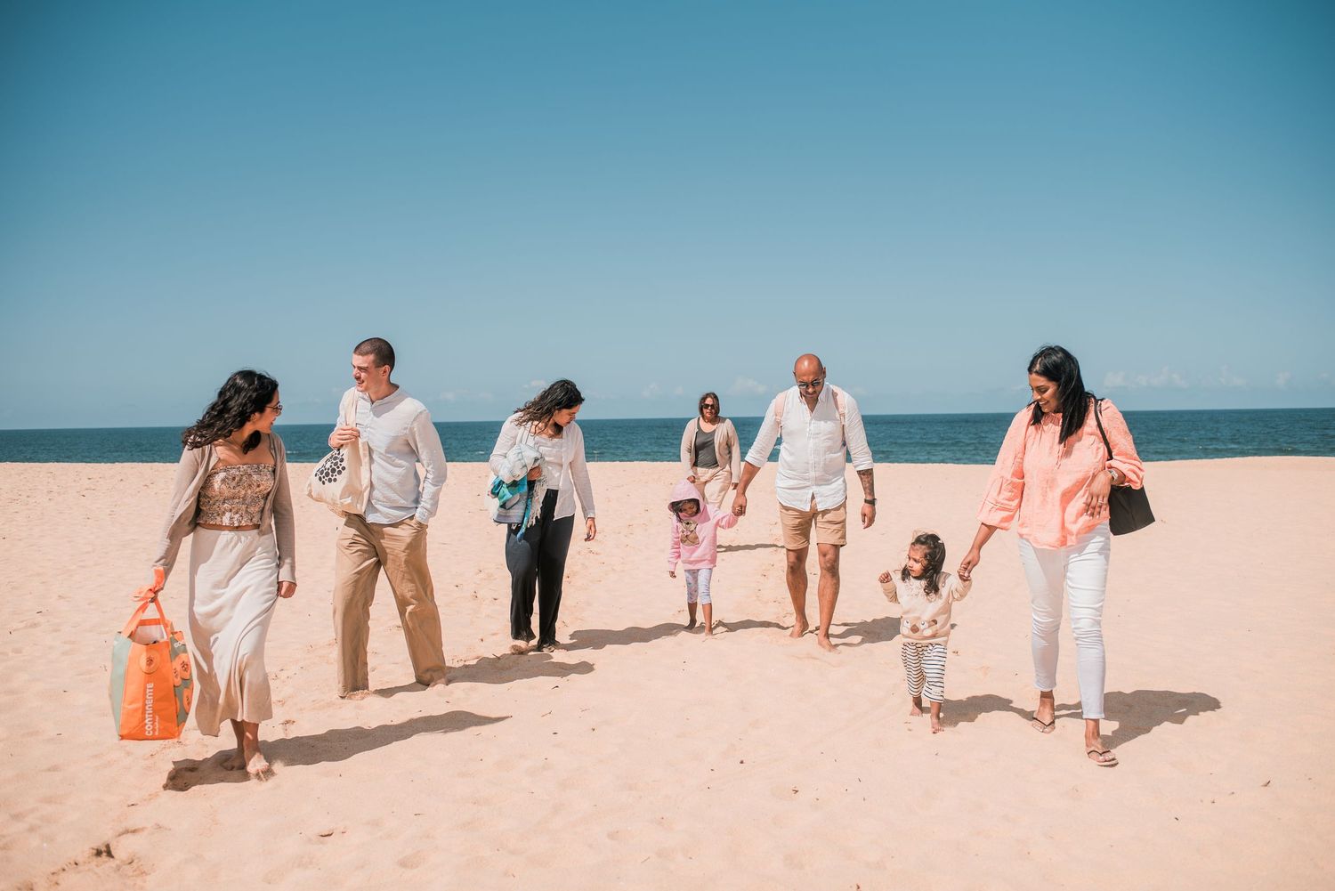 Natural and joyful family moments captured on a Portuguese beach.
