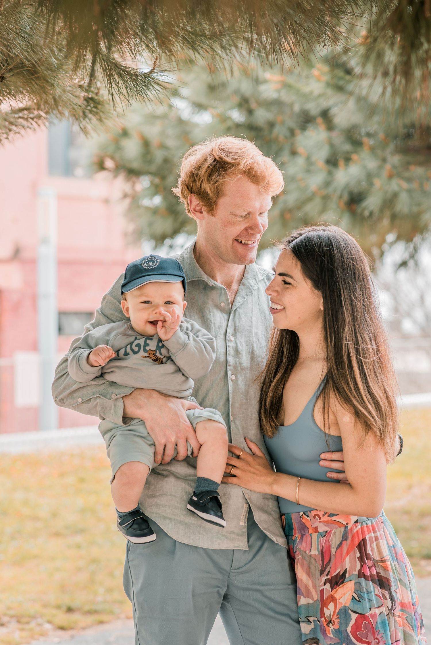 Parents and children sharing a joyful moment during a family session in Lisbon.