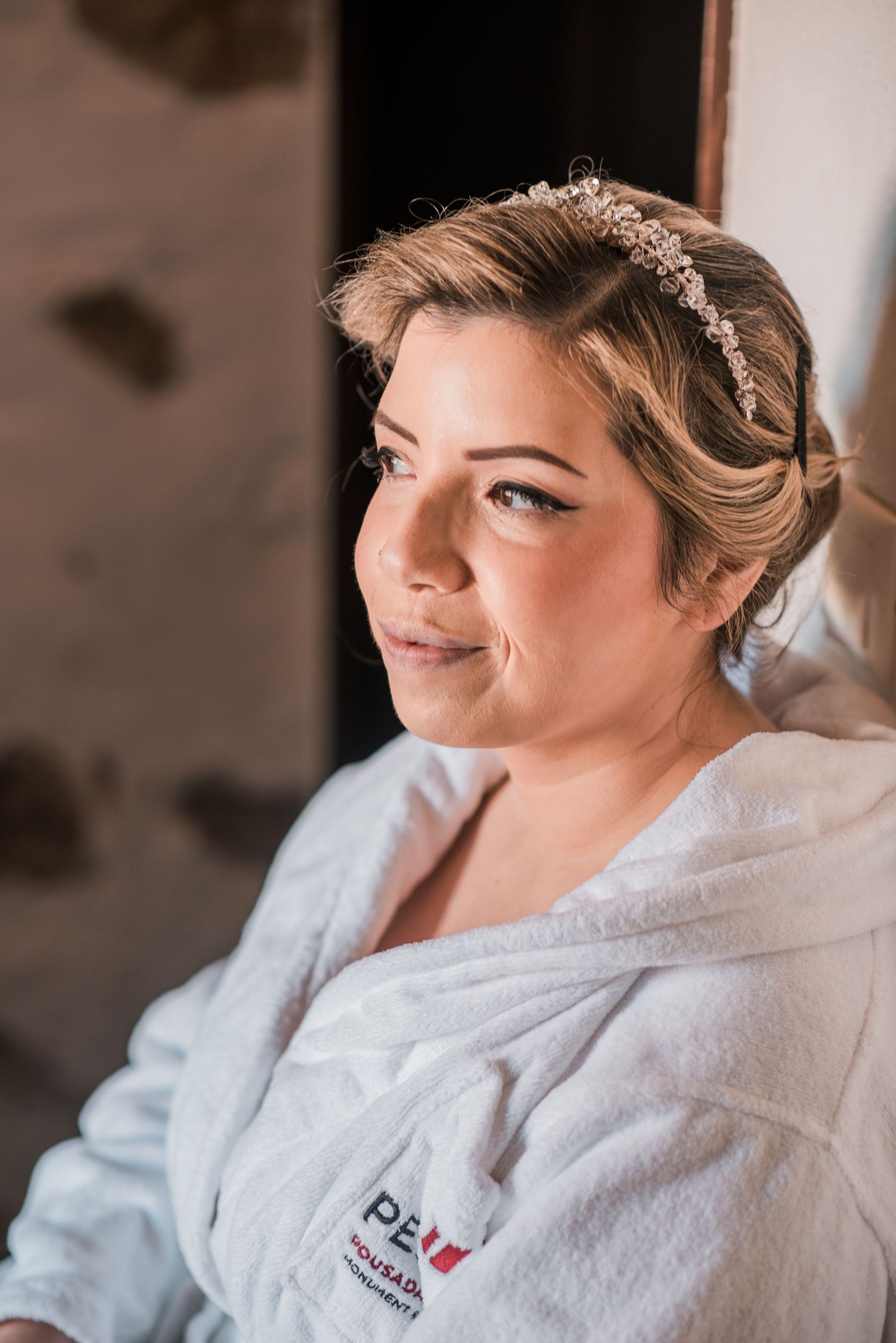 Elegant bride during destination wedding preparations in Óbidos, Portugal.