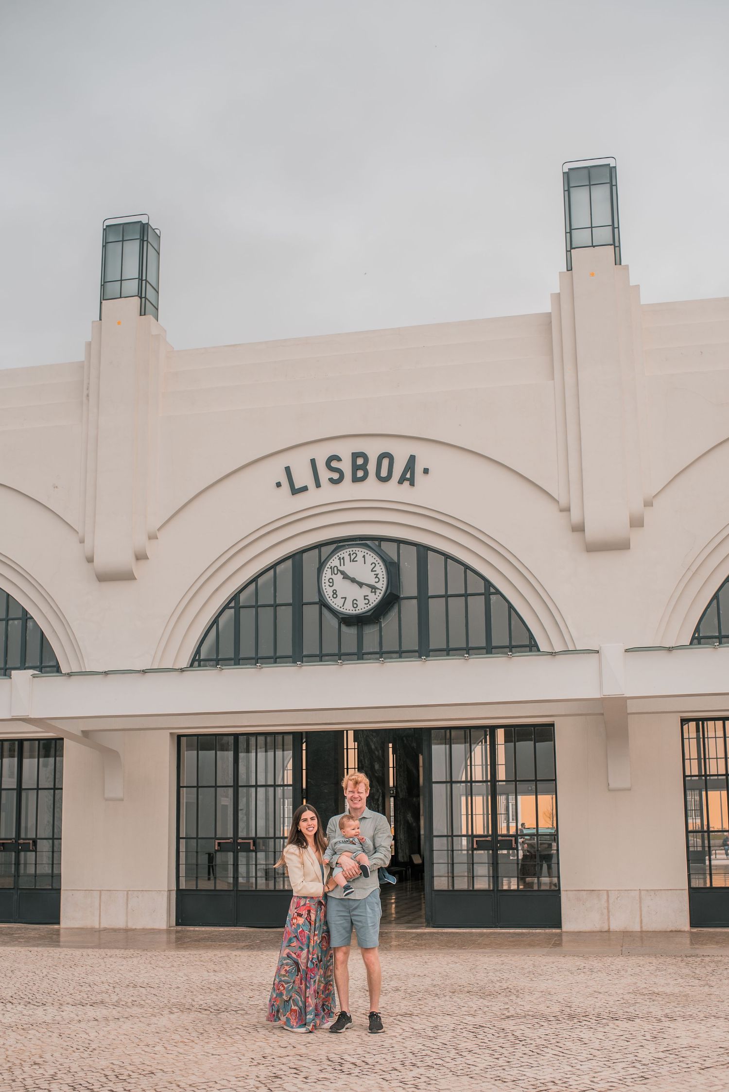 Parents and children sharing a joyful moment during a family session in Lisbon.