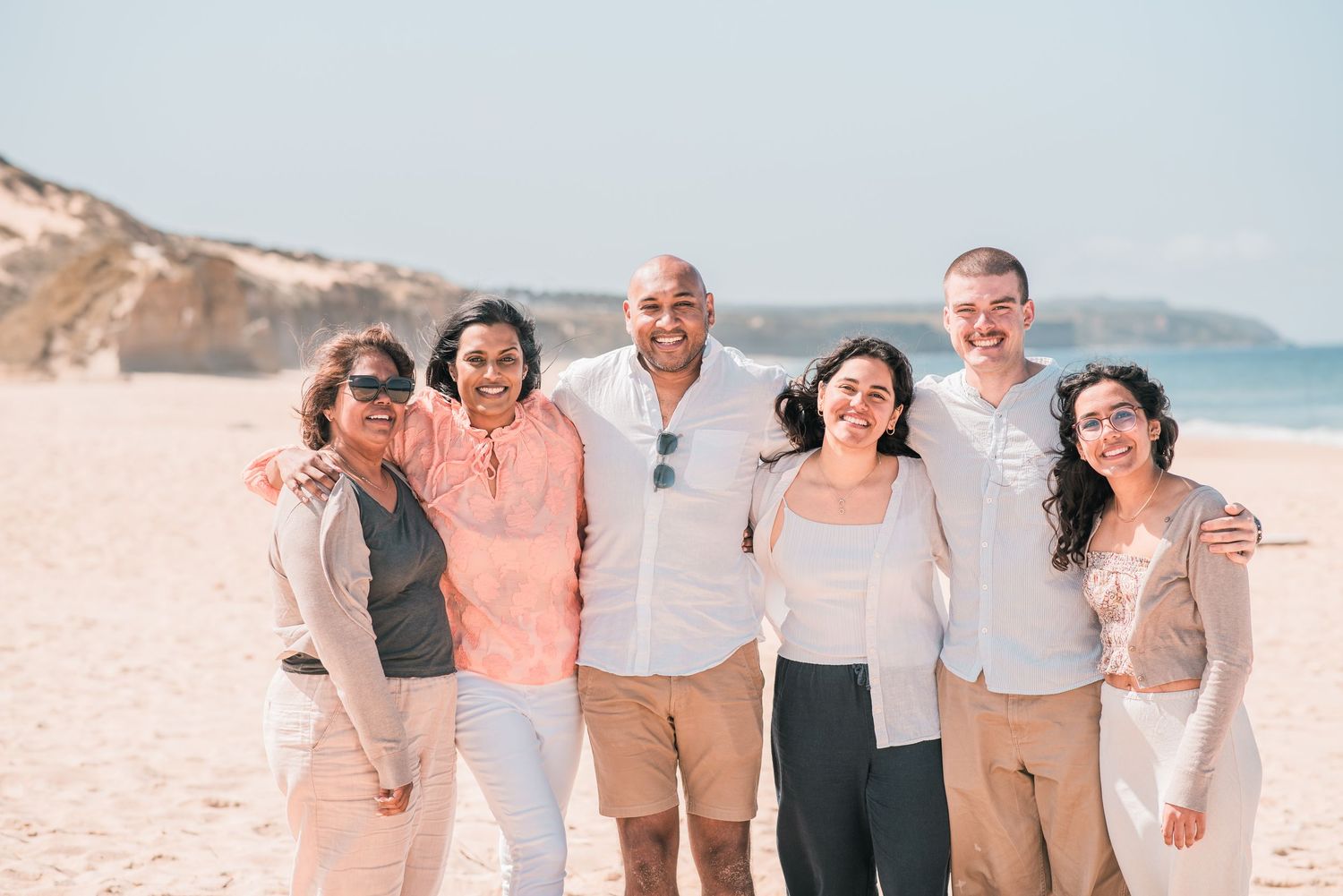 Natural and joyful family moments captured on a Portuguese beach.