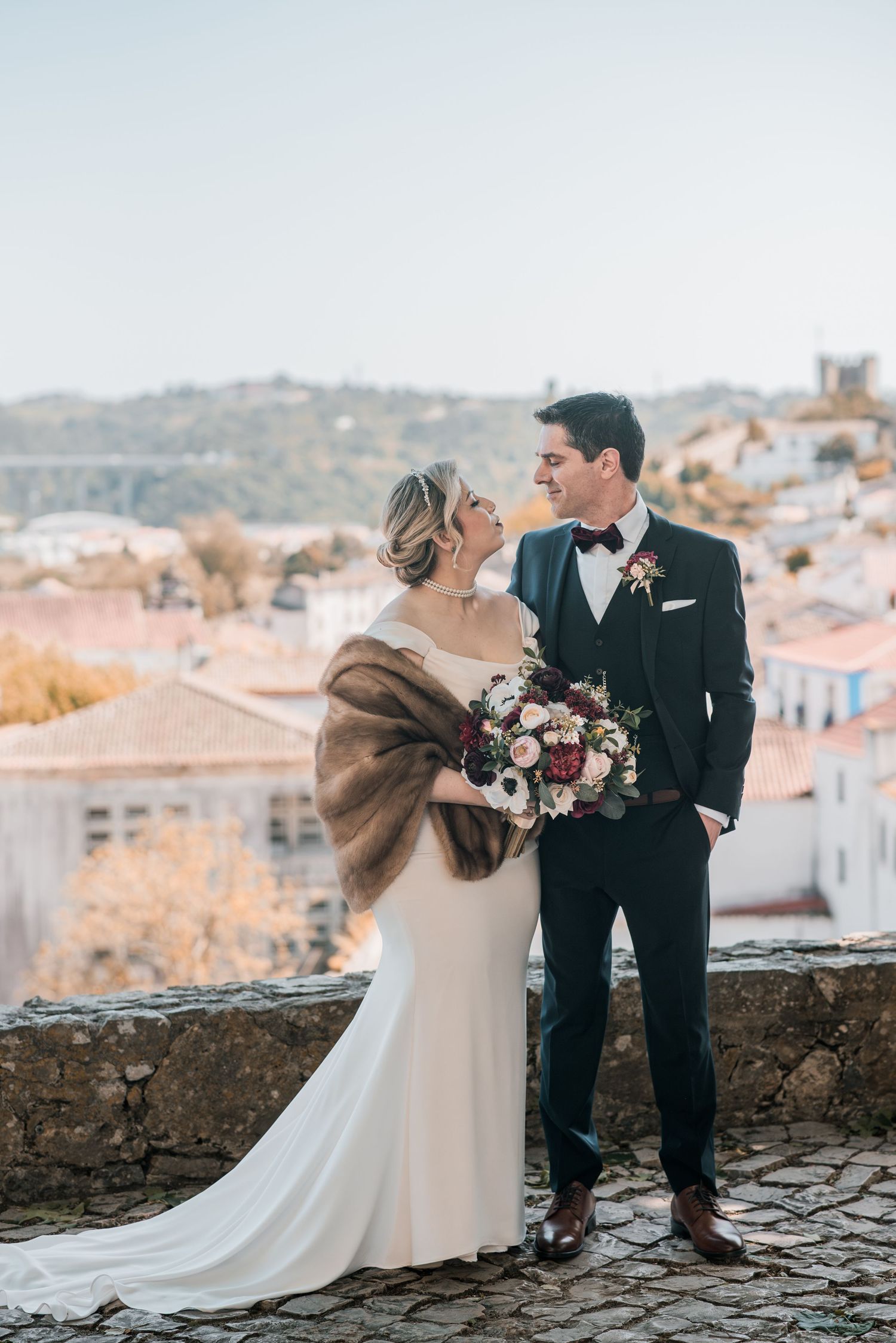 Romantic wedding portraits inside the medieval walls of Óbidos, Portugal.