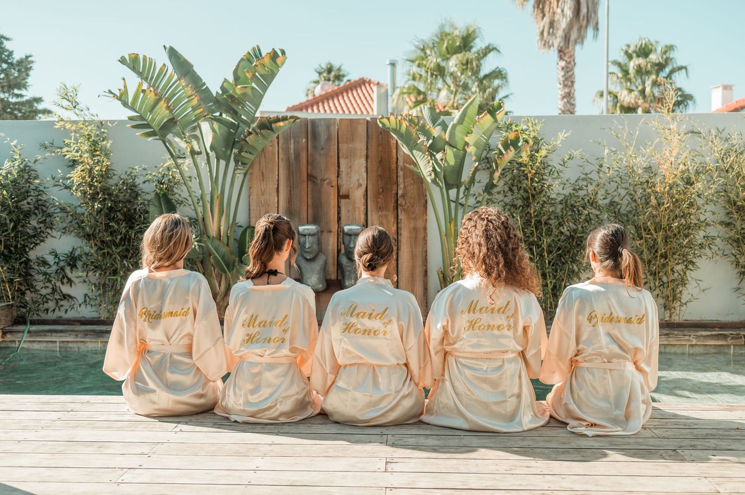 Elegant bridesmaids during destination wedding preparations in Cascais, Portugal.