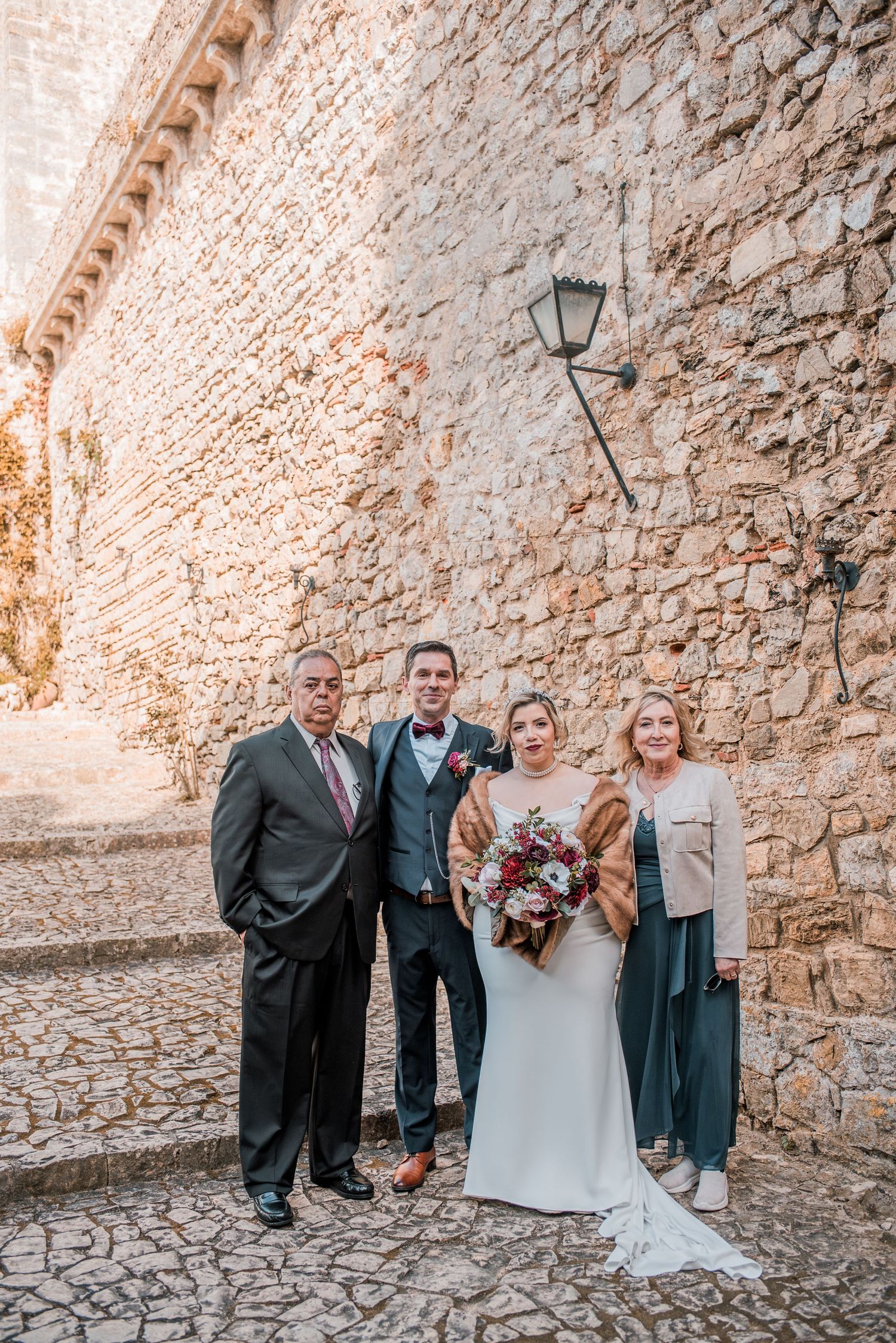 Intimate wedding ceremony at Pousada Castelo de Óbidos with emotional moments and warm atmosphere.