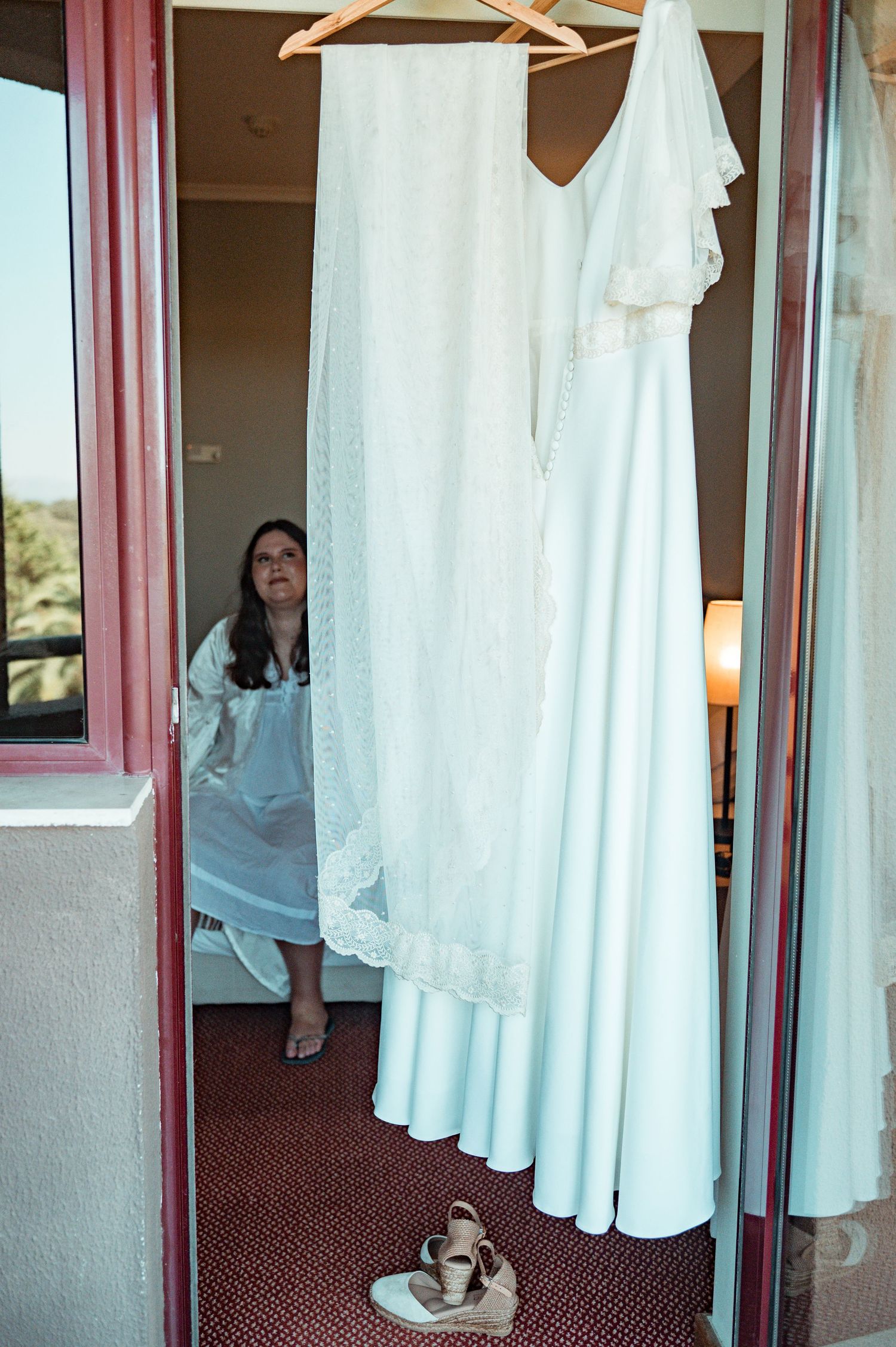 Bride in her wedding preparation in the historic center of Évora, Portugal.