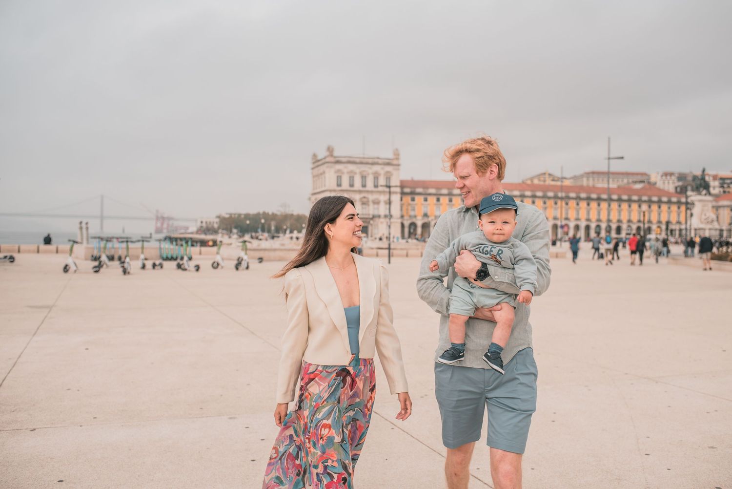 Parents and children sharing a joyful moment during a family session in Lisbon.