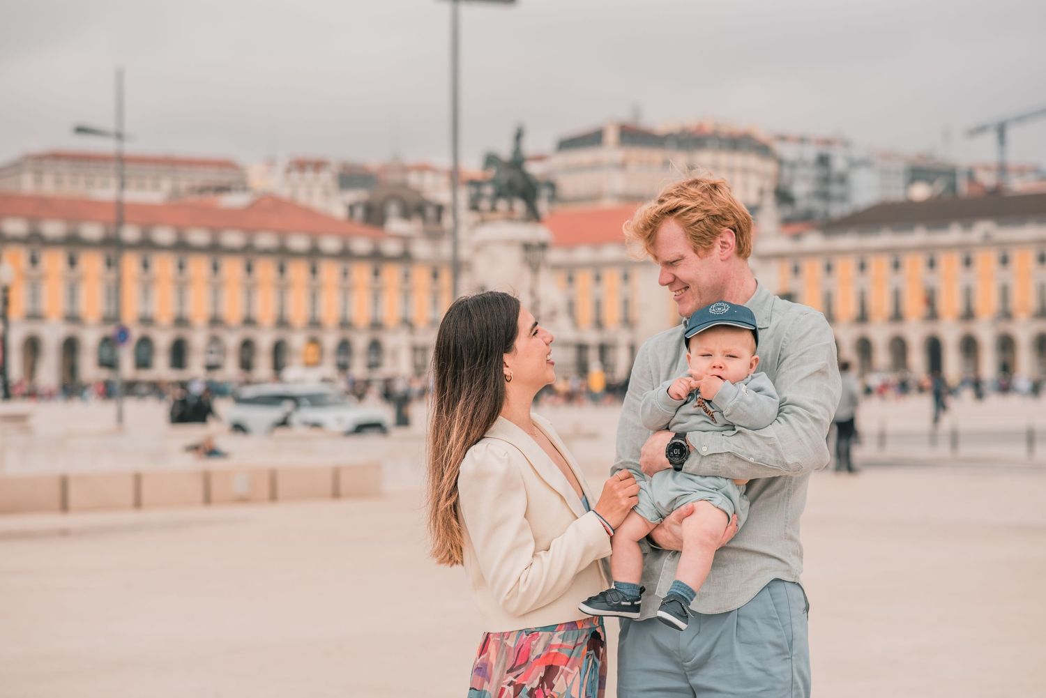 Parents and children sharing a joyful moment during a family session in Lisbon.