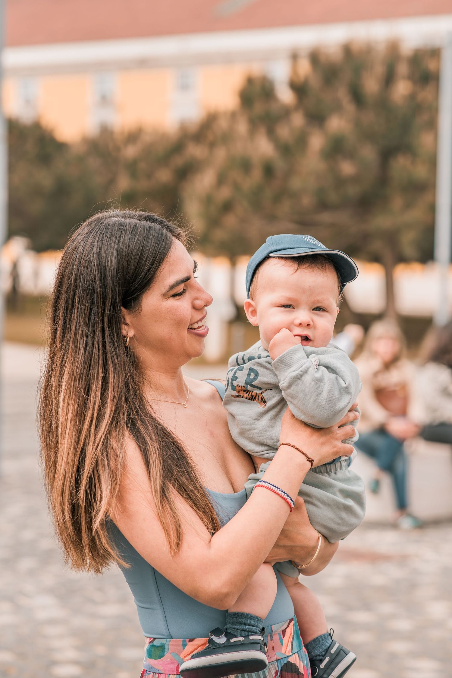 Parents and children sharing a joyful moment during a family session in Lisbon.