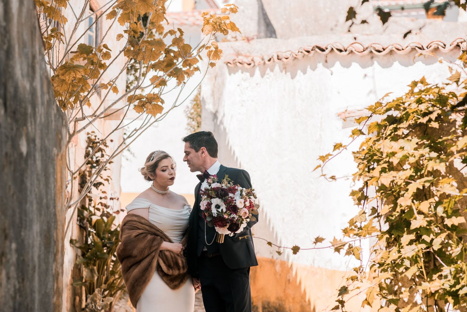 Romantic wedding portraits inside the medieval walls of Óbidos, Portugal.