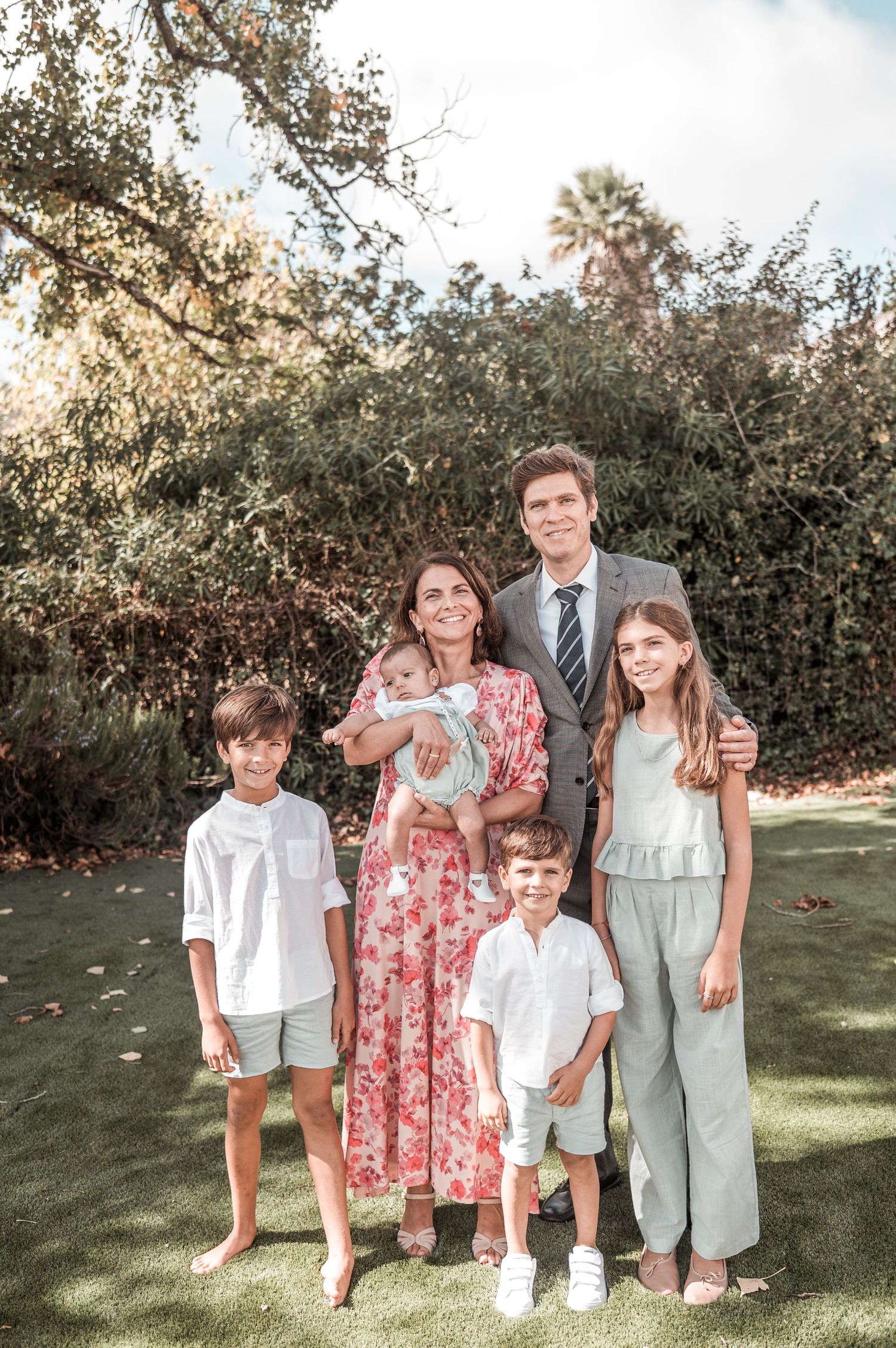 Emotional baptism celebration with family and close friends in Portugal.