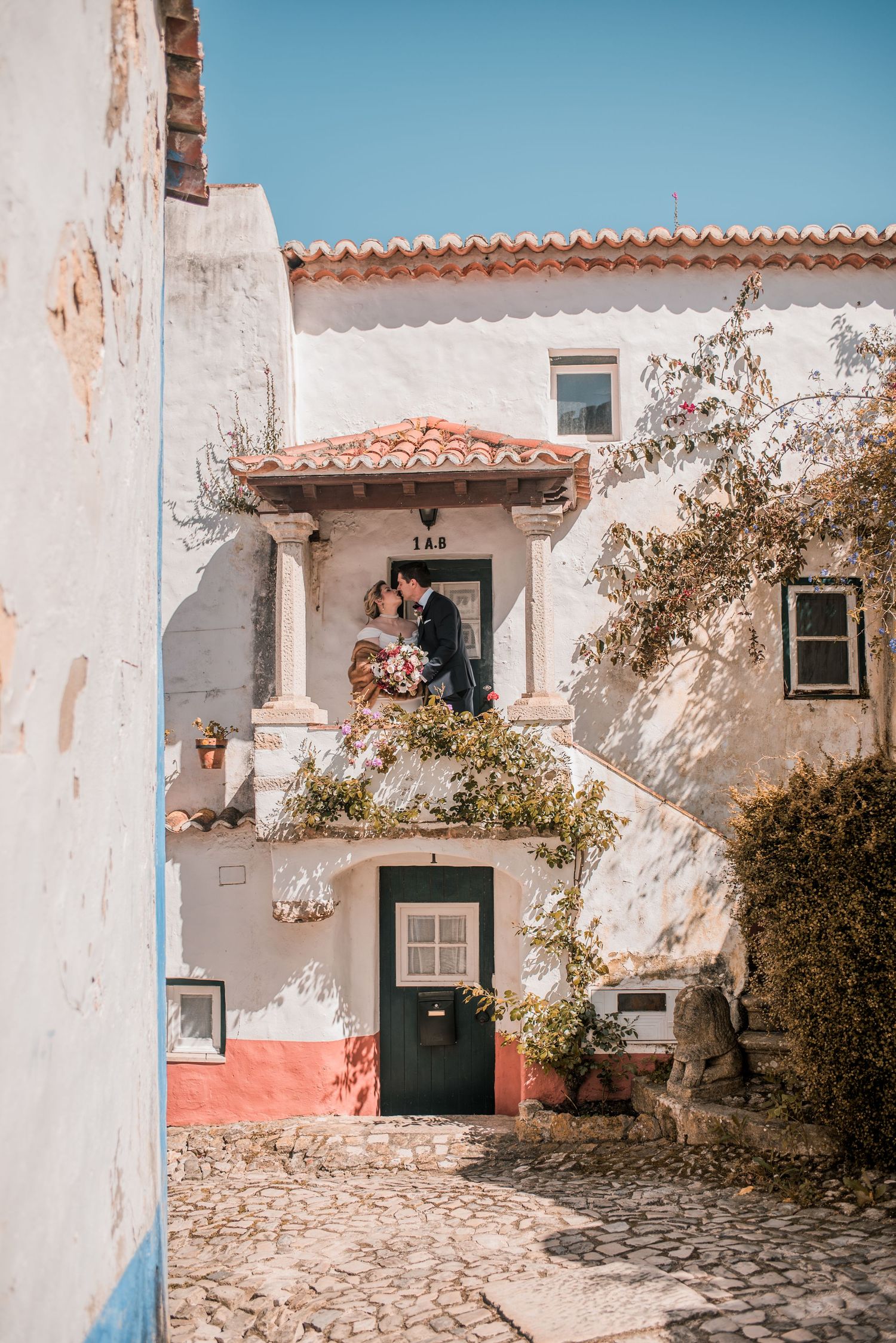 Romantic wedding portraits inside the medieval walls of Óbidos, Portugal.