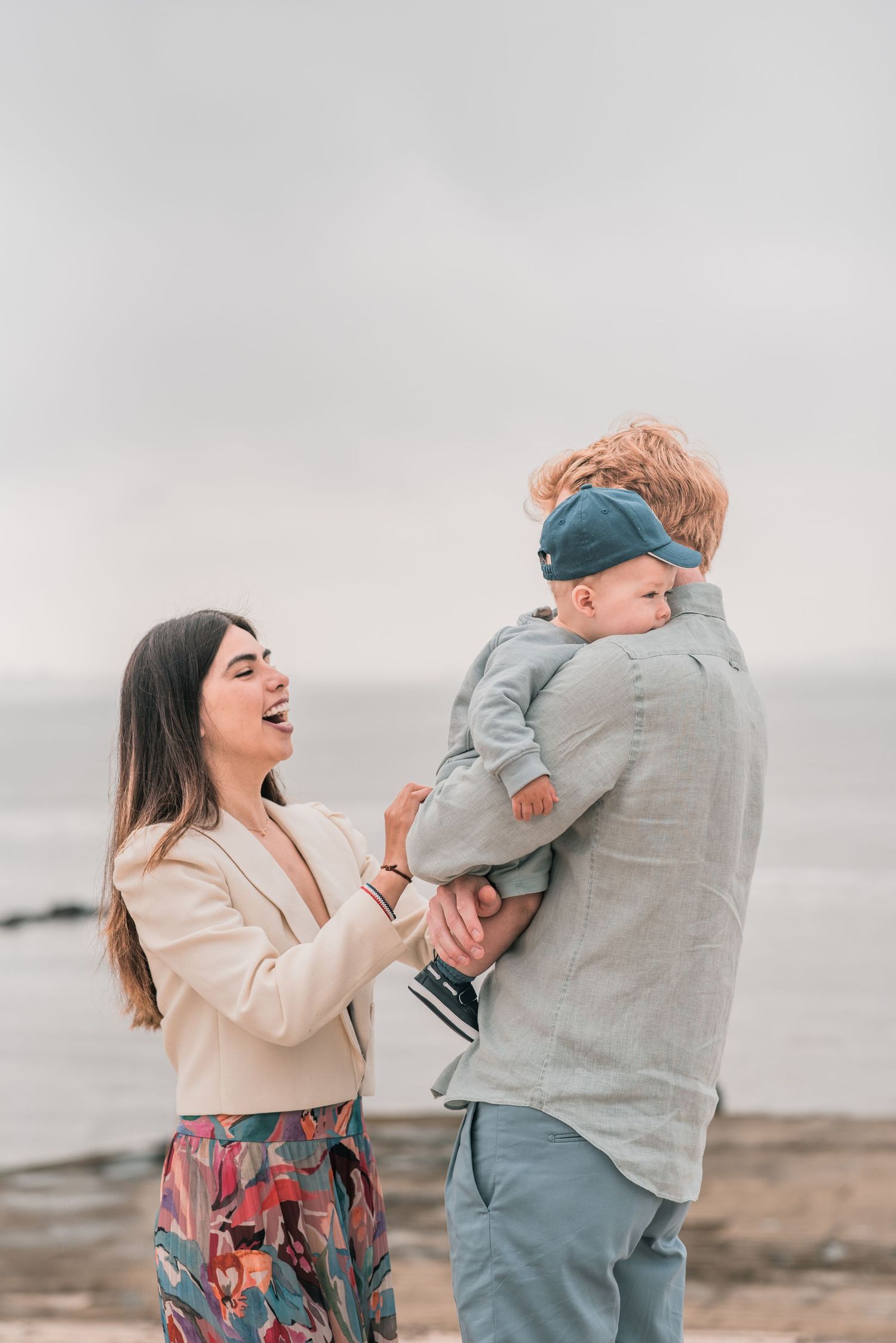 Parents and children sharing a joyful moment during a family session in Lisbon.