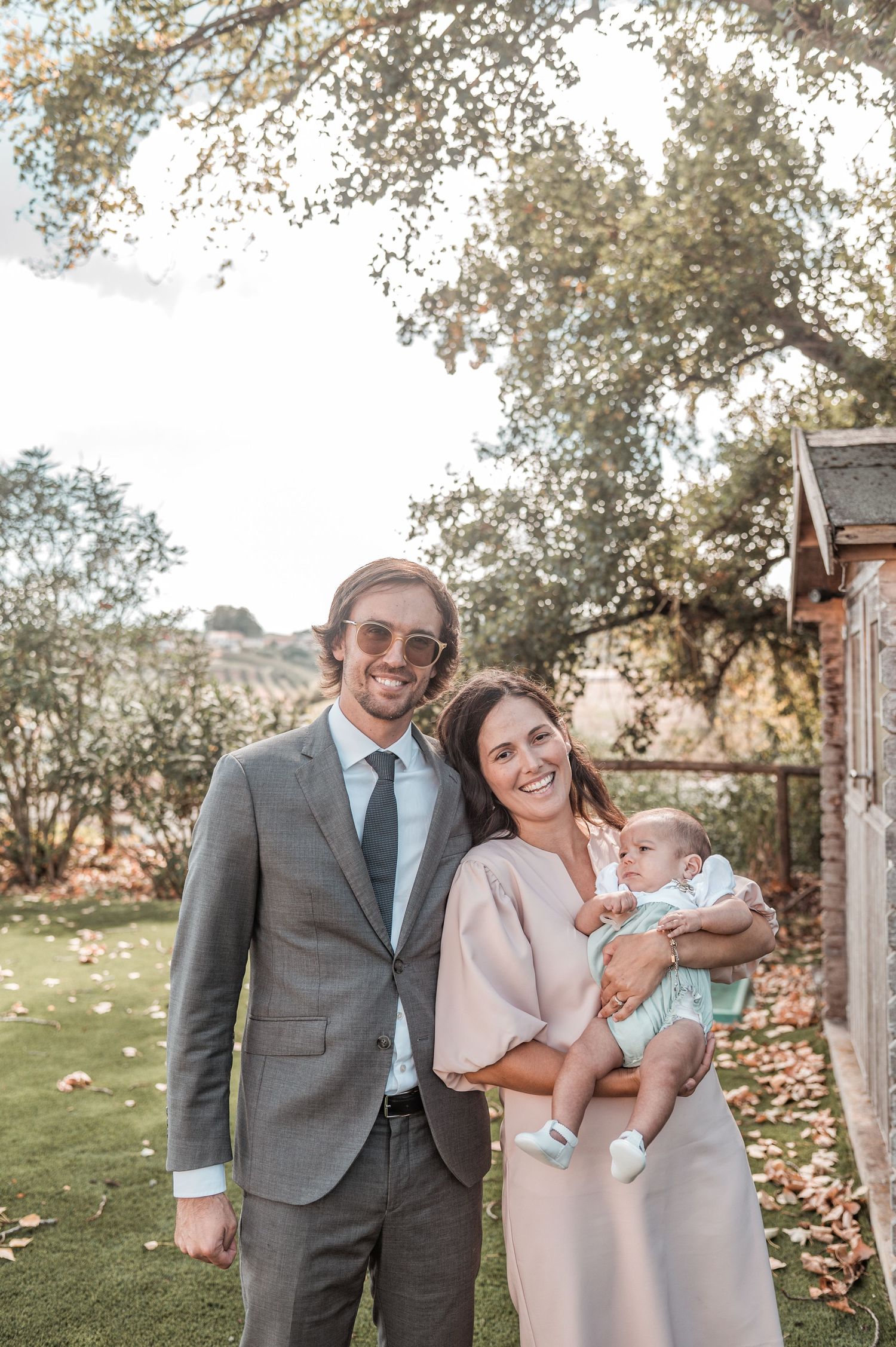 Emotional baptism celebration with family and close friends in Portugal.