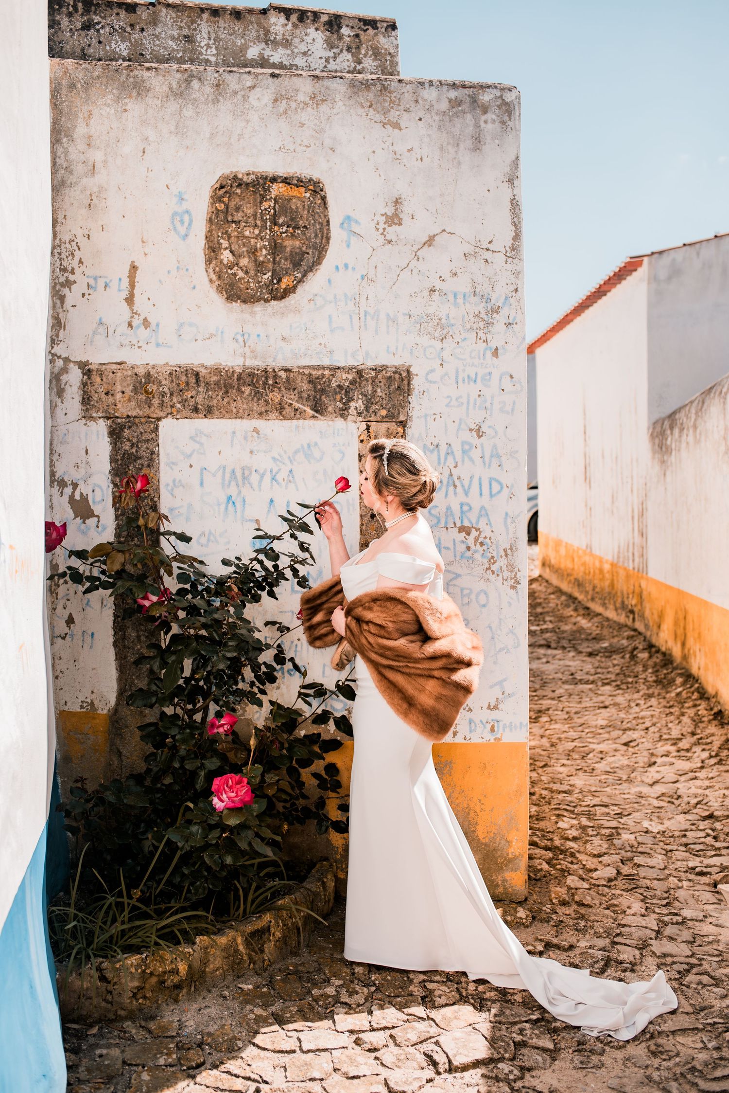 Destination wedding couple sharing a quiet moment in Óbidos, Portugal.