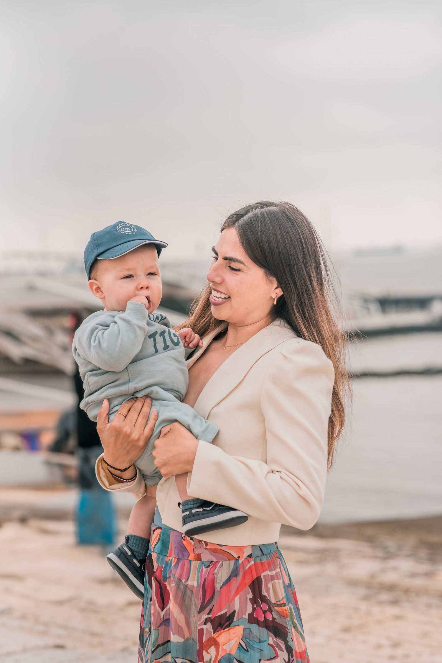 Parents and children sharing a joyful moment during a family session in Lisbon.