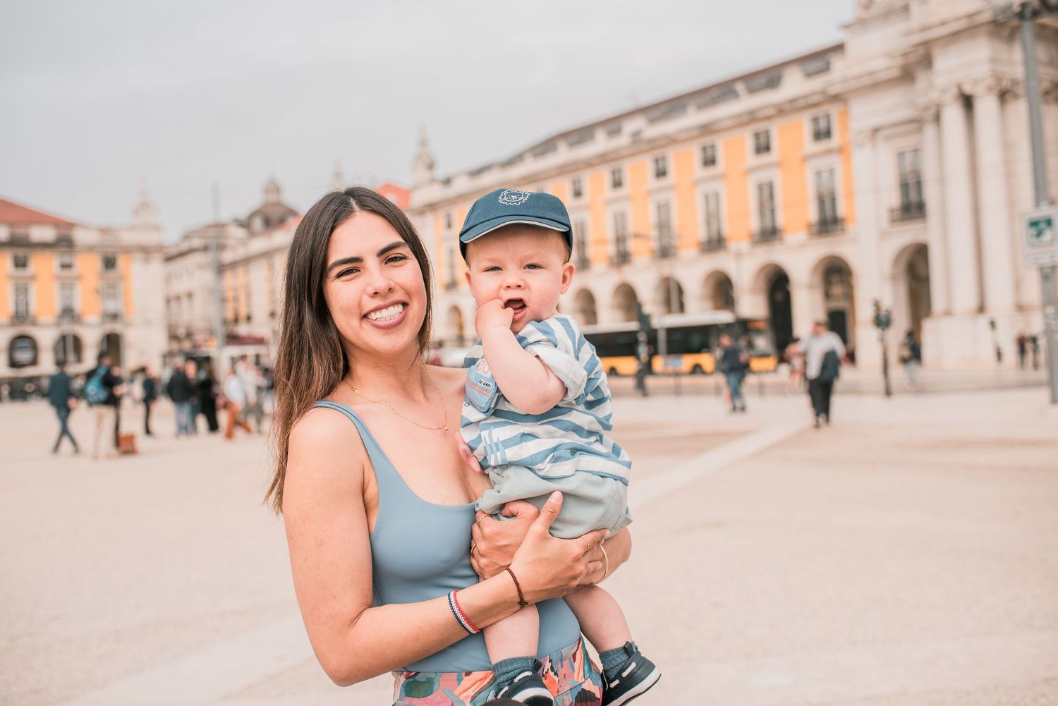 Parents and children sharing a joyful moment during a family session in Lisbon.
