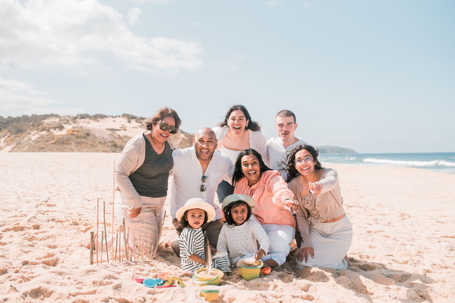 Natural and joyful family moments captured on a Portuguese beach.