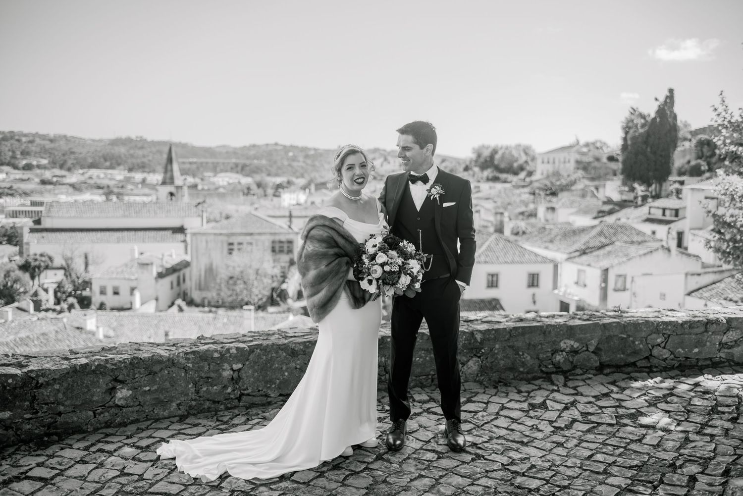 Romantic wedding portraits inside the medieval walls of Óbidos, Portugal.
