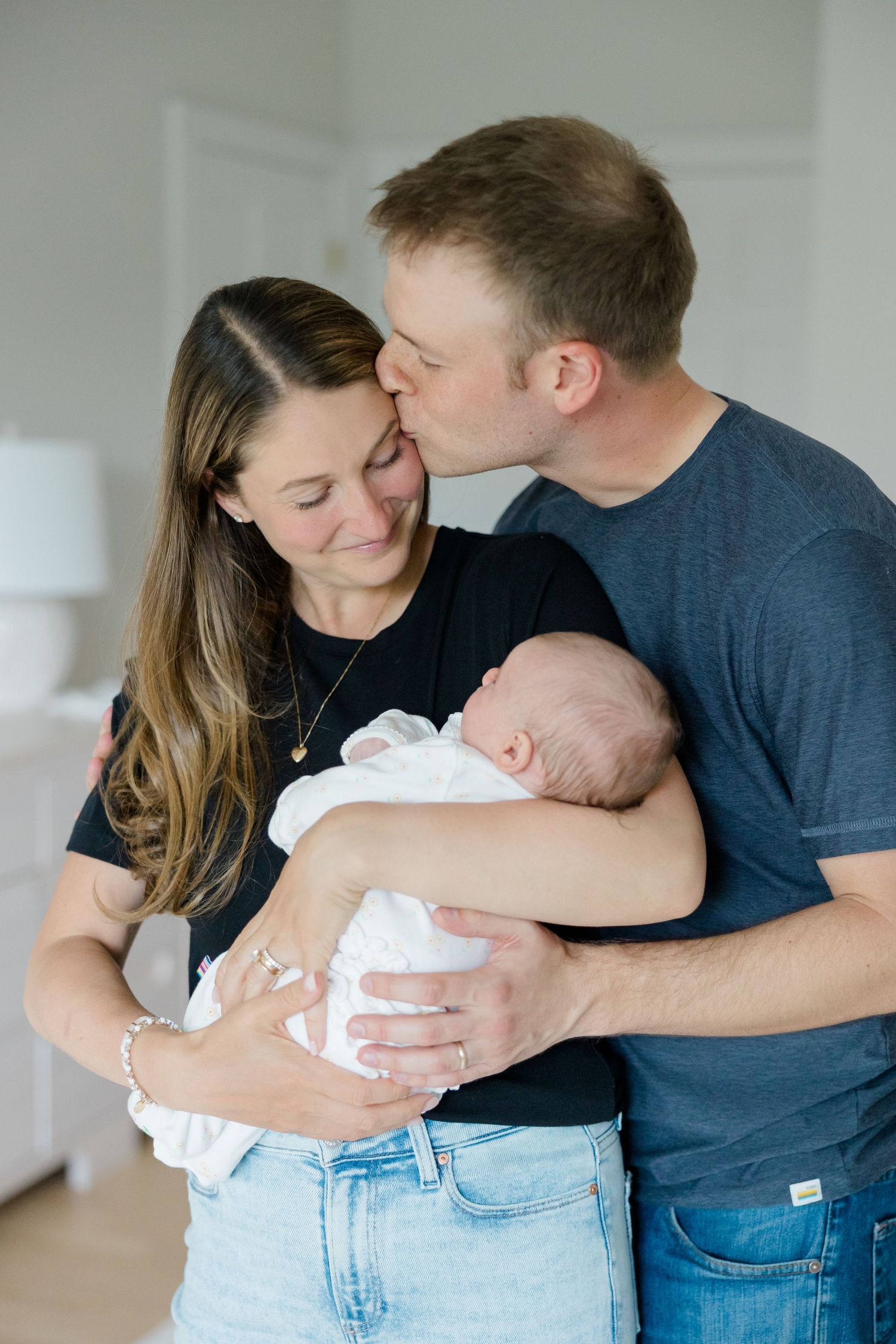An intimate family moment shared with a newborn baby.