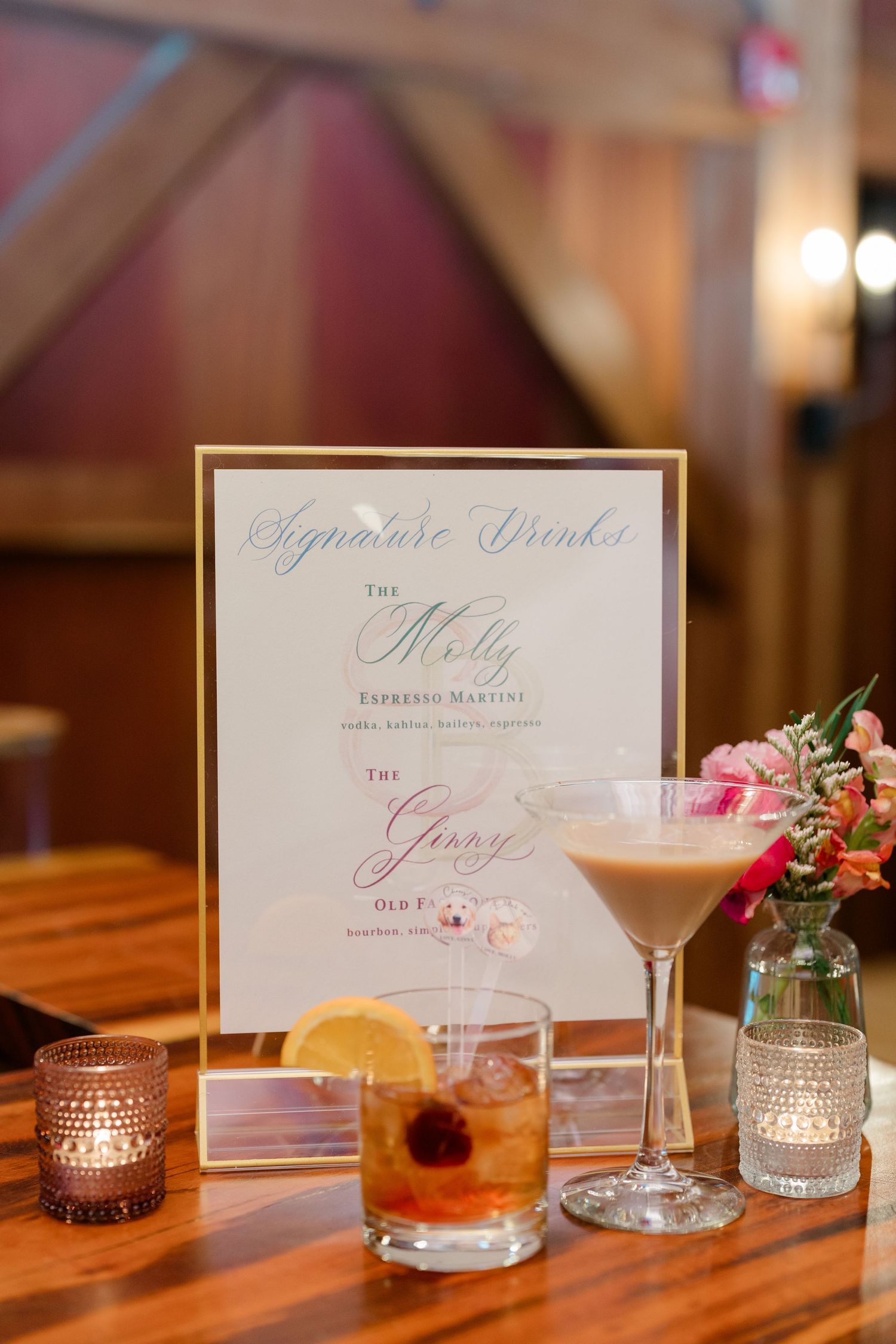 Elegant wedding cocktail menu display with signature drinks and soft candlelight.