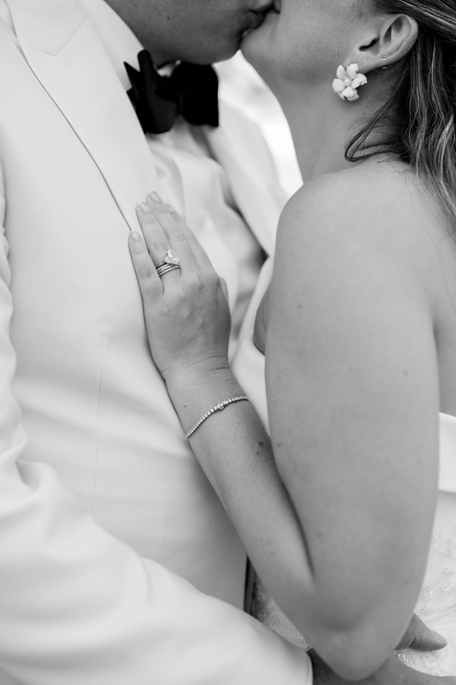 A series of romantic black and white closeup photos showing intimate moments between two people kissing.