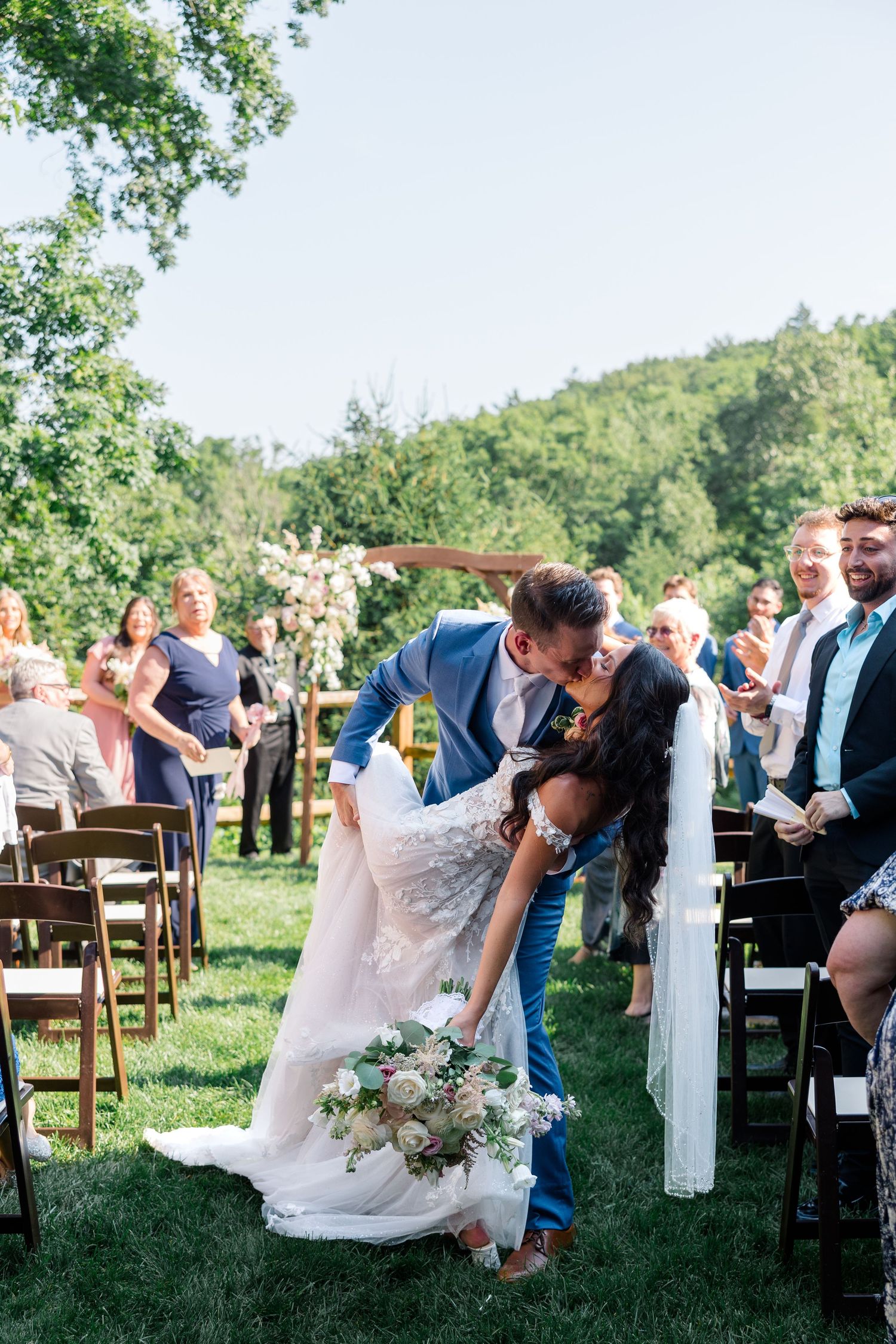 Series of elegant outdoor garden wedding ceremony moments showing couple seated in white chairs among guests.