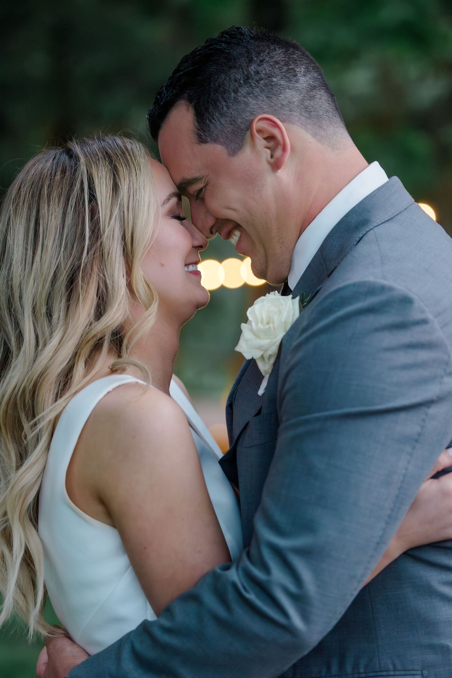 A romantic moment shared between newlyweds during golden hour.