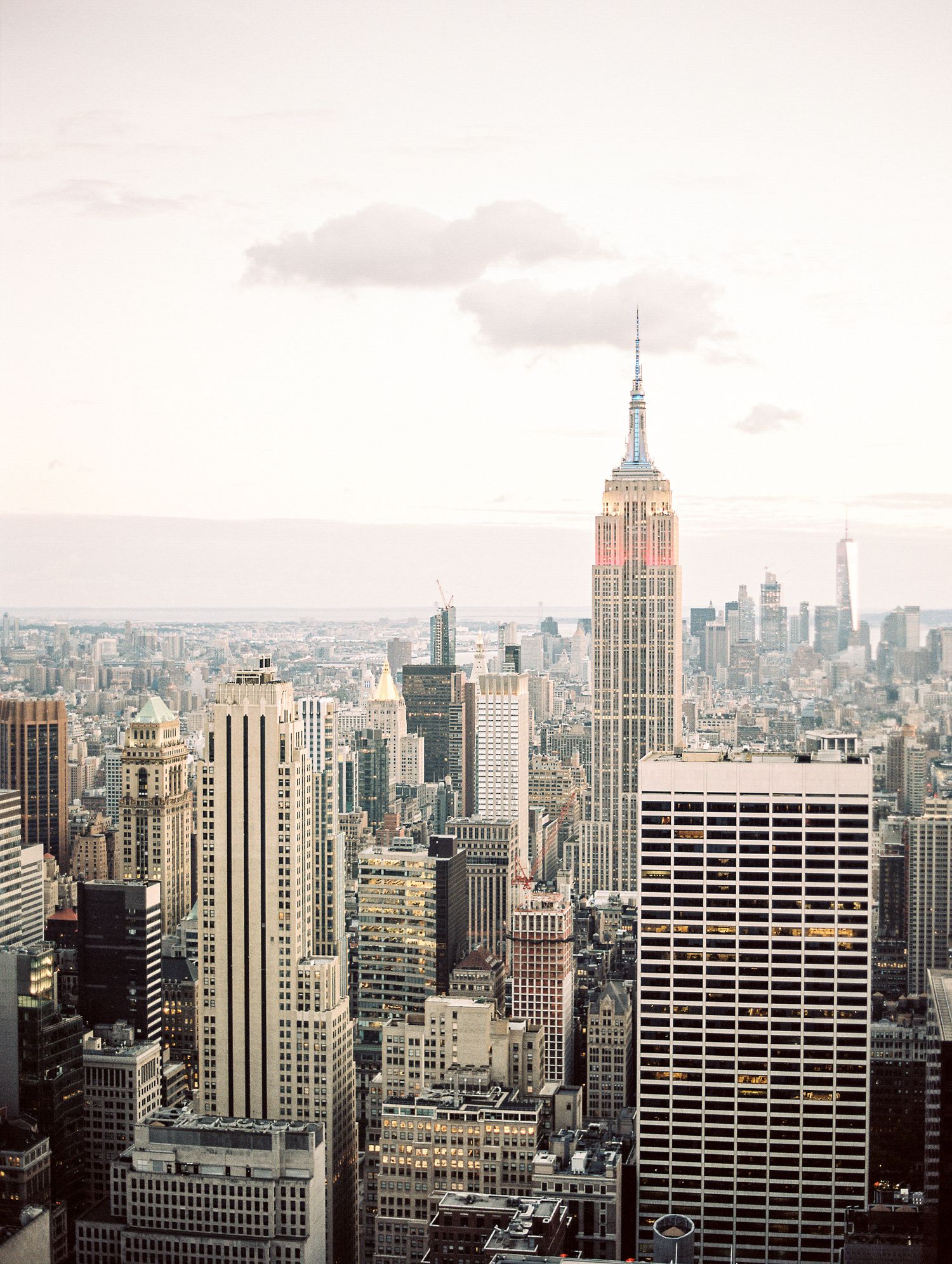 New York City skyline featuring the iconic Empire State Building during sunset.