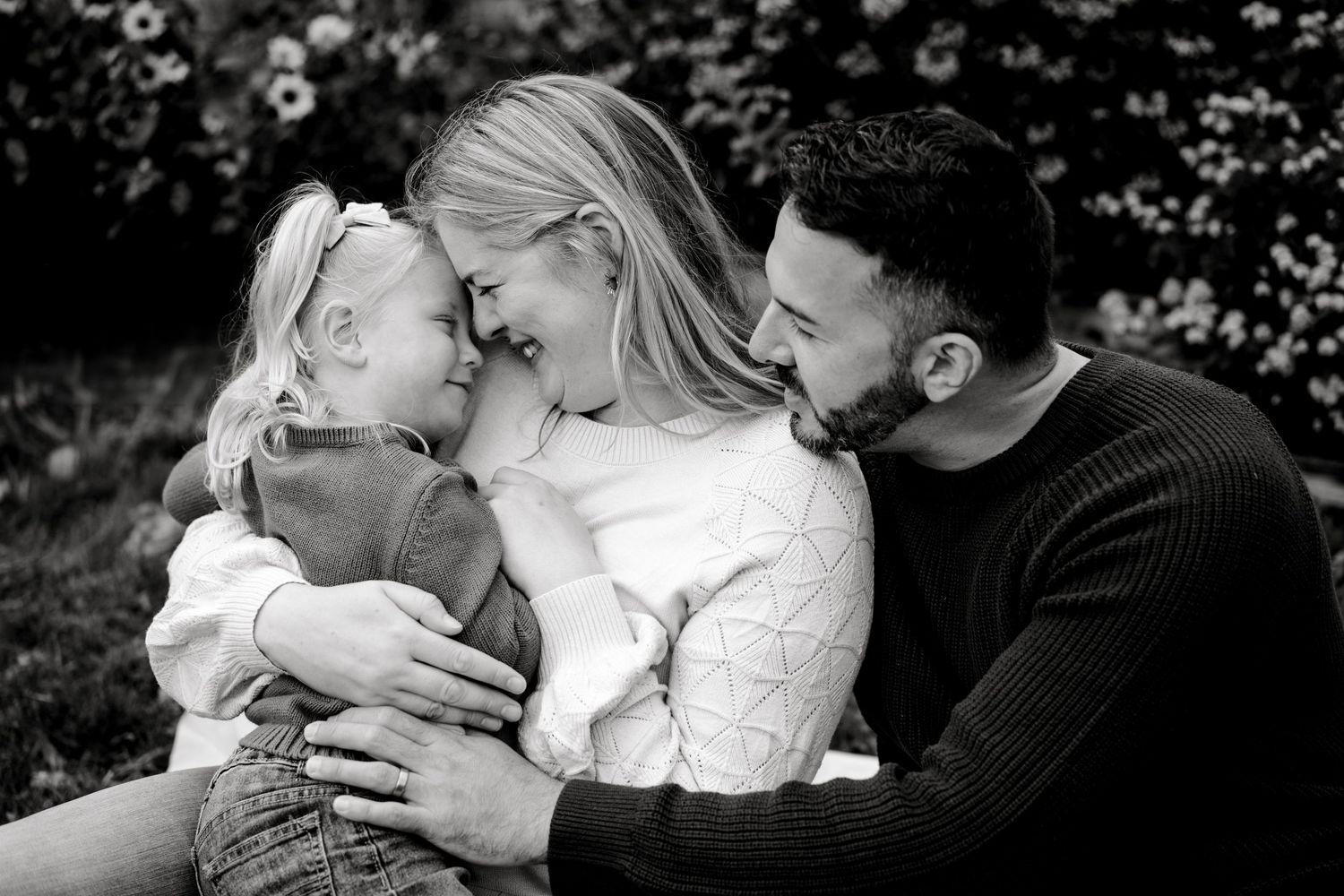 Black and white romantic wedding photos showing intimate kisses and embraces between couples during their special moments.