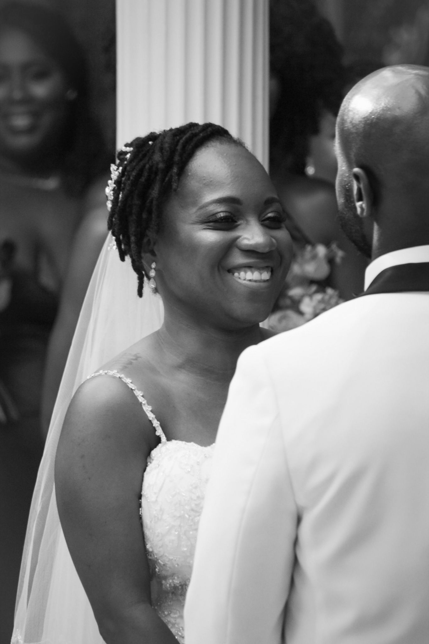 Joyful wedding ceremony moment captured in black and white.