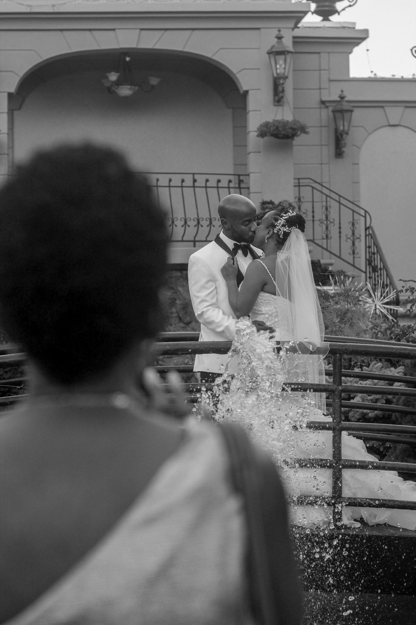 Artistic black and white sequence of water splashing at an outdoor wedding venue.