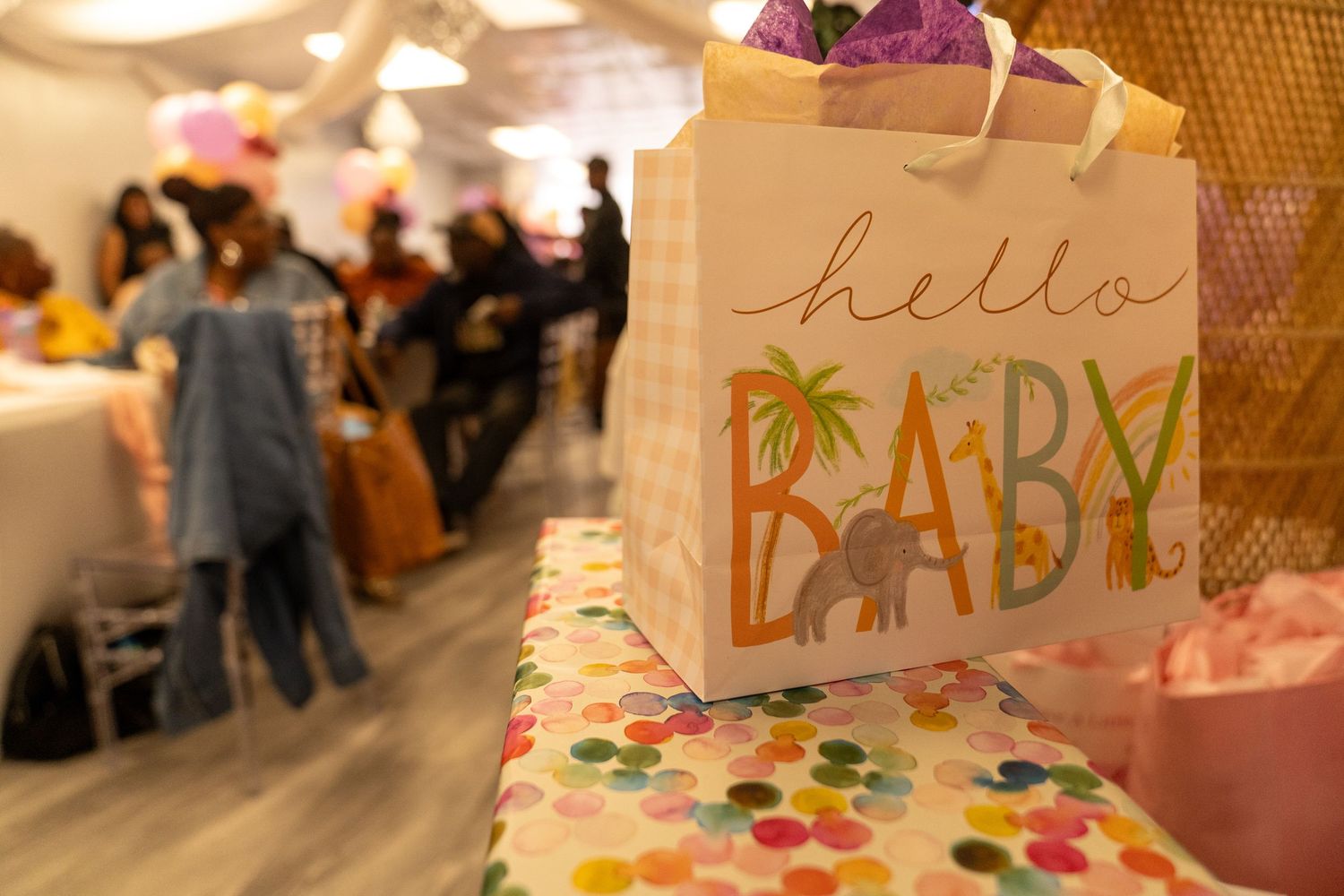 Decorative signs and banners with colorful text displayed at an event.