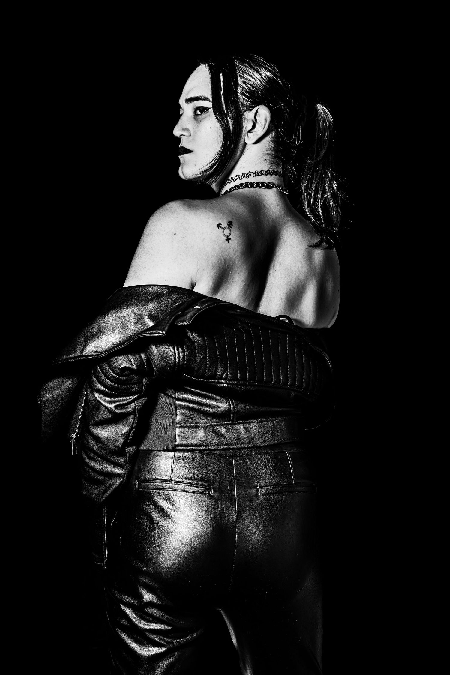 black and white image with side profile, shoulder facing the camera
