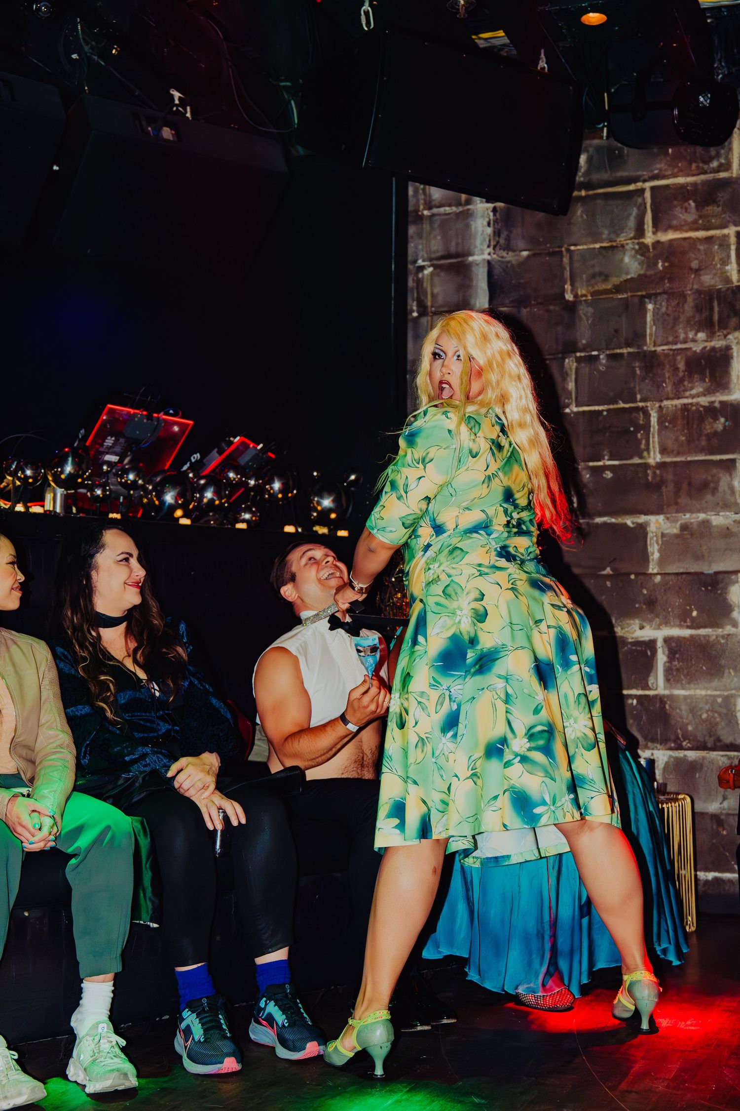 performer interacting with audience, while looking at the camera