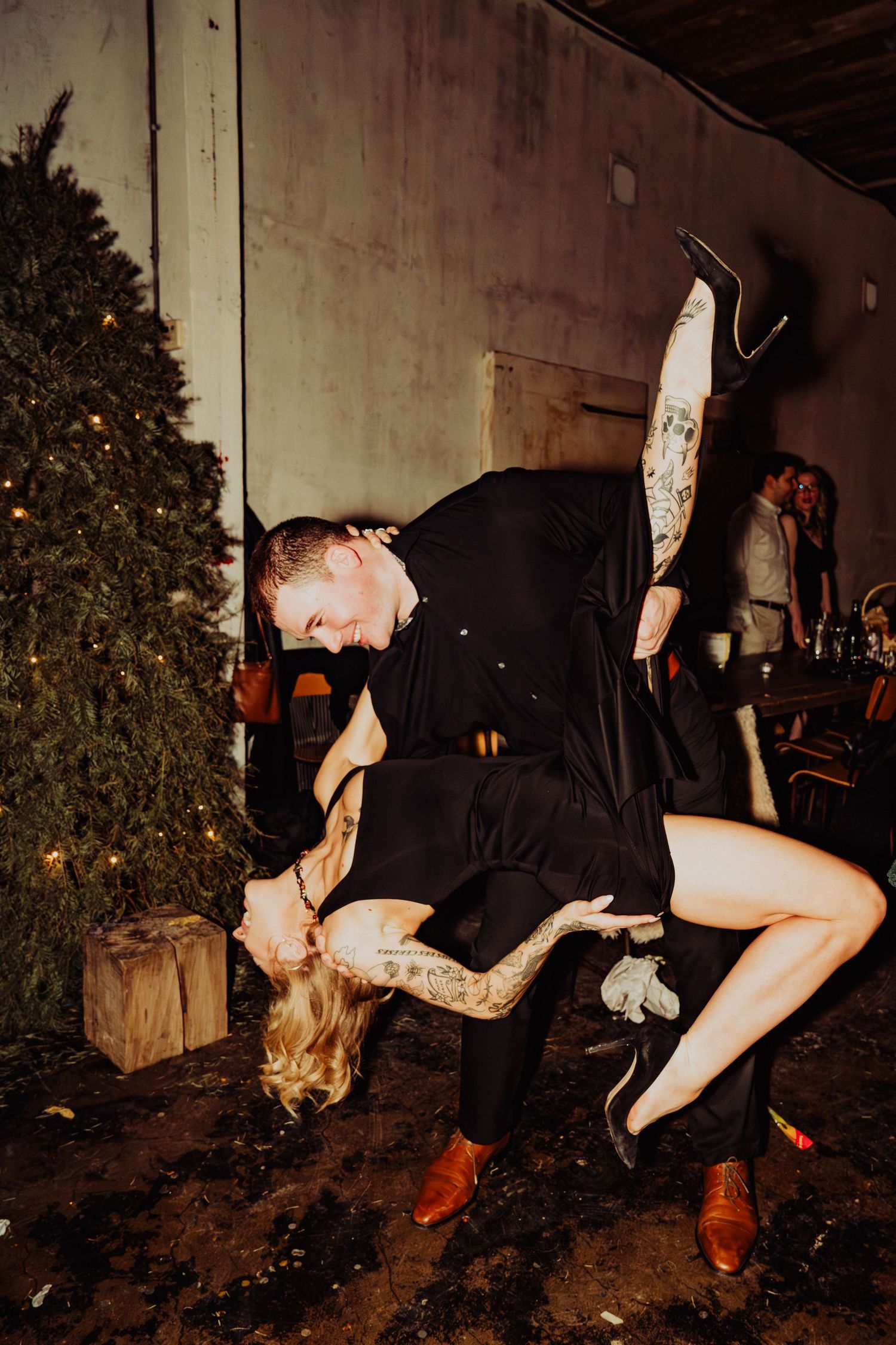 man bending woman over in a pose on new years eve