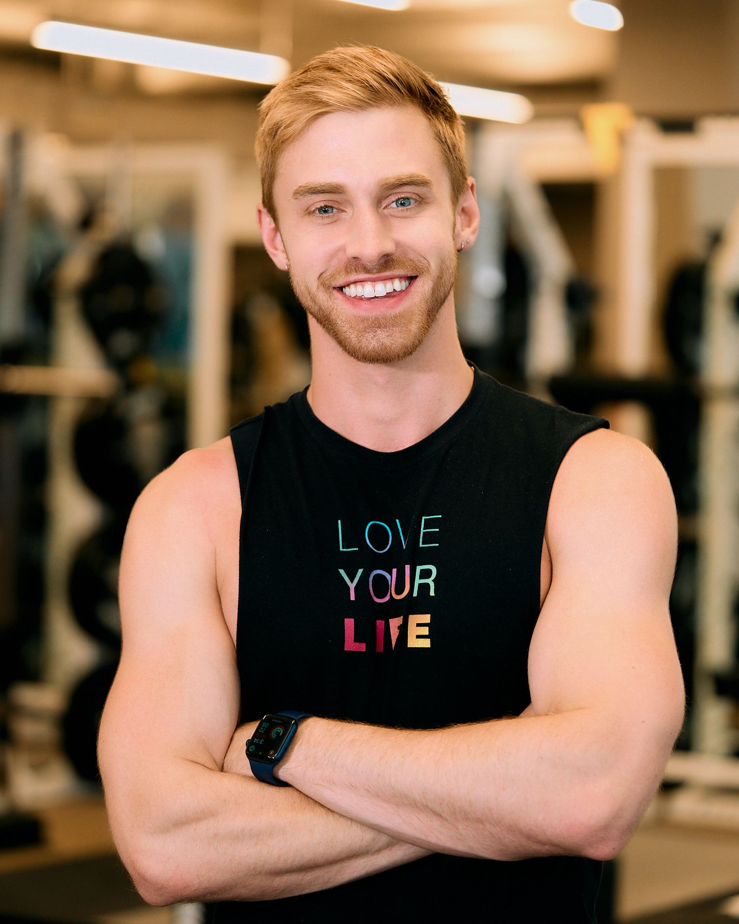 A series of four connected photos showing a person in a black tank top with different words spelling 'LOVE YOUR LIFE' across them.