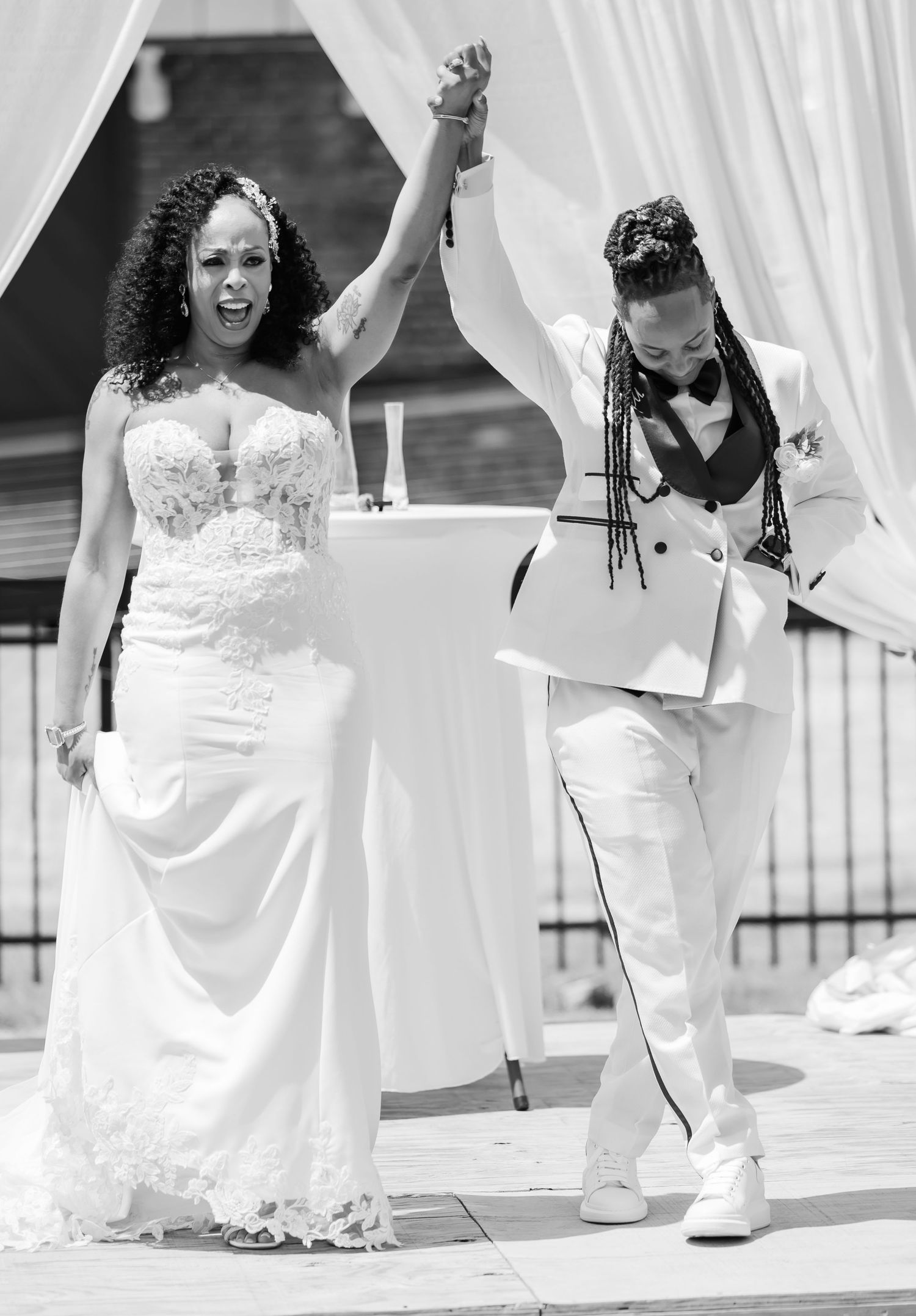 A series of wedding ceremony moments captured against white drapery in black and white photography.
