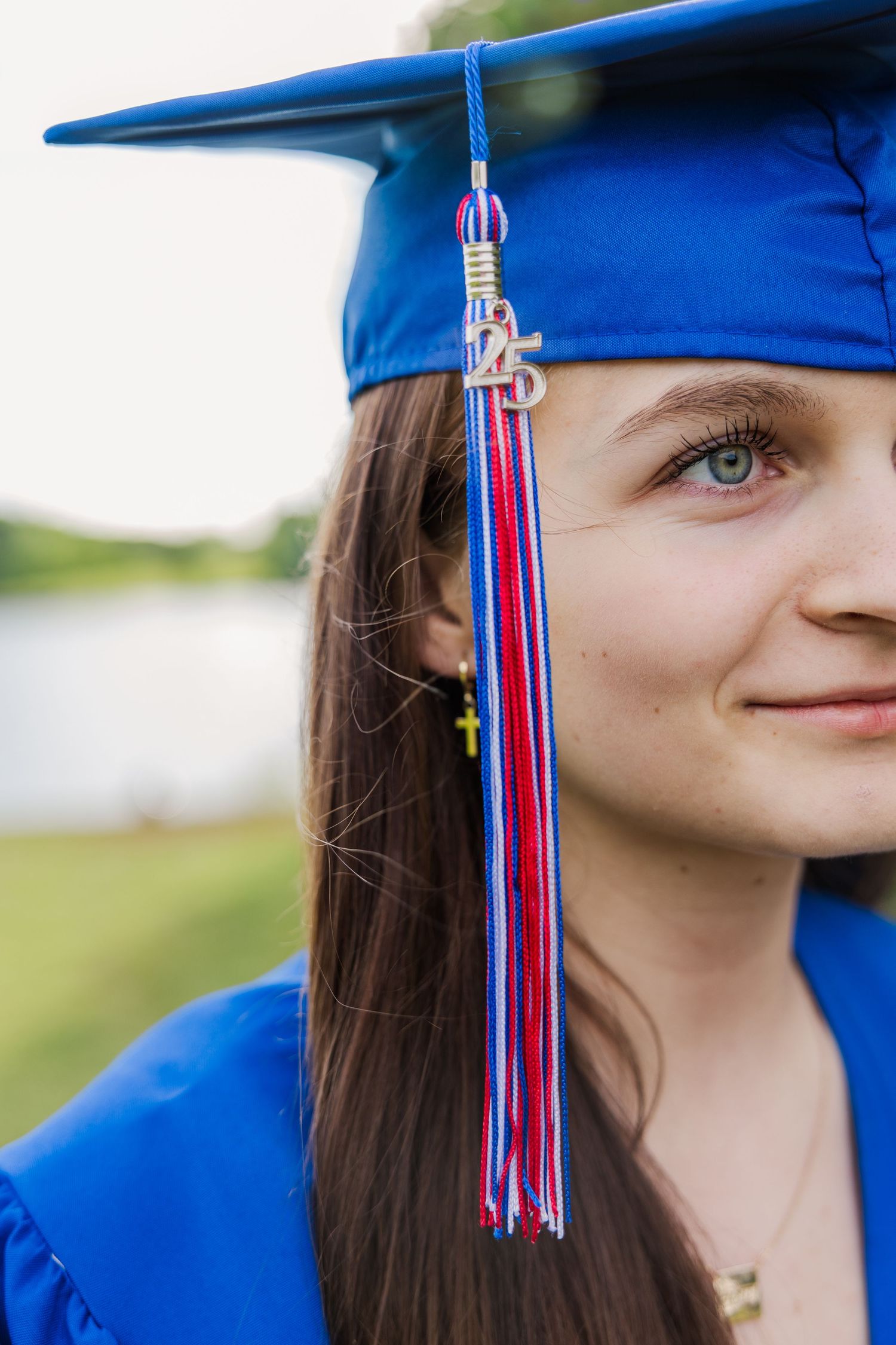 Close-up graduation photos showing a blue cap with red and white tassel against natural background.