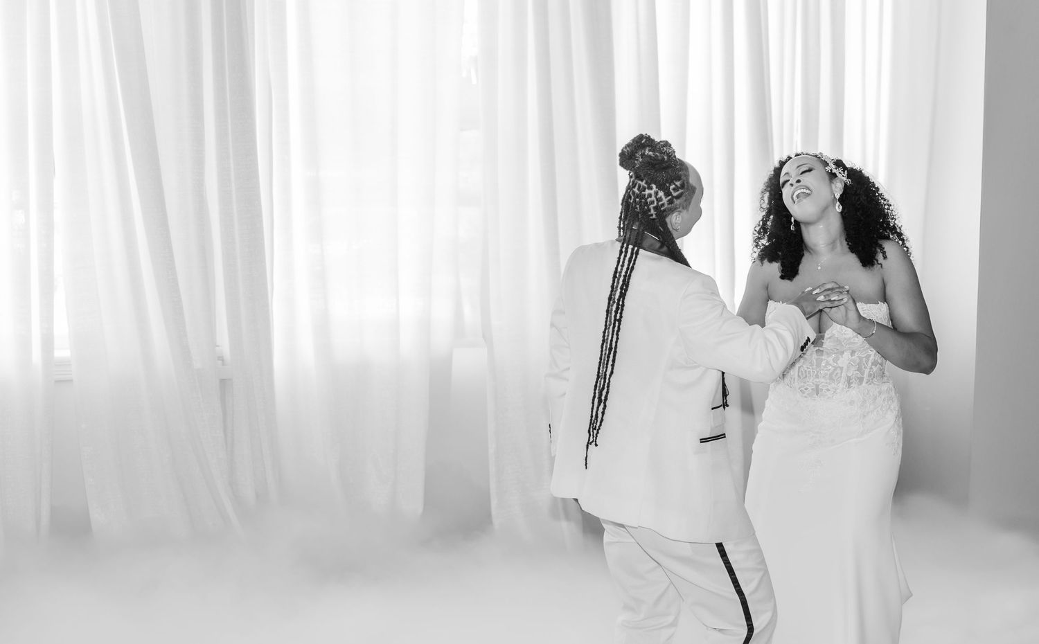 Intimate wedding ceremony moments photographed through white drapery.
