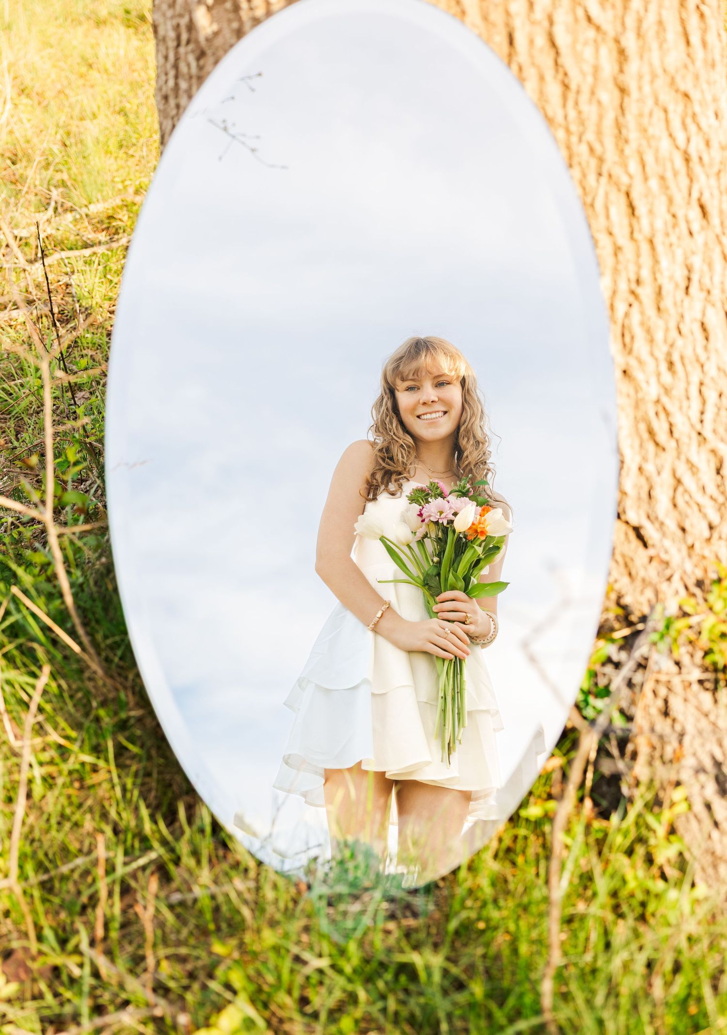 White circular frames capture outdoor graduation portraits in golden sunlight.