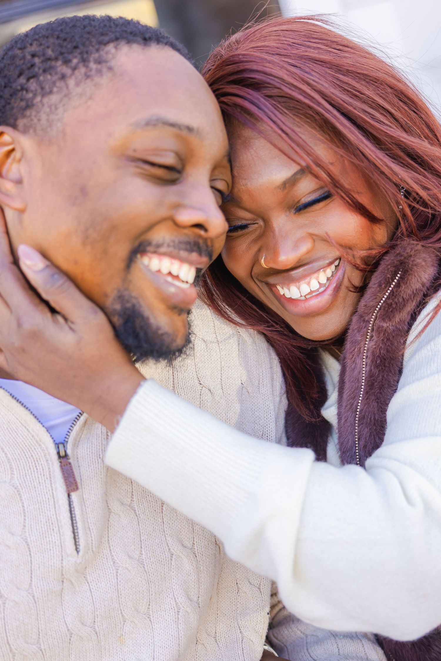 A couple shares intimate romantic moments in a series of candid outdoor photos showing their affection and laughter.