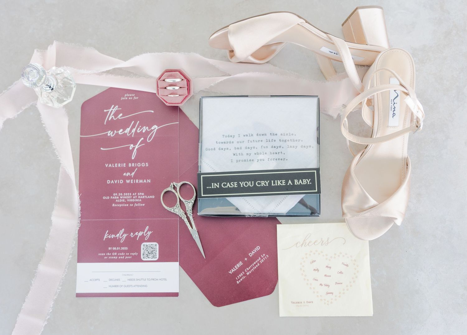 Elegant wedding invitation suite in dusty rose and cream colors with delicate ribbon details.
