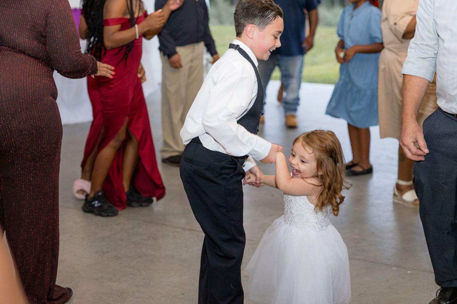Wedding guests dance and socialize during the reception celebration.