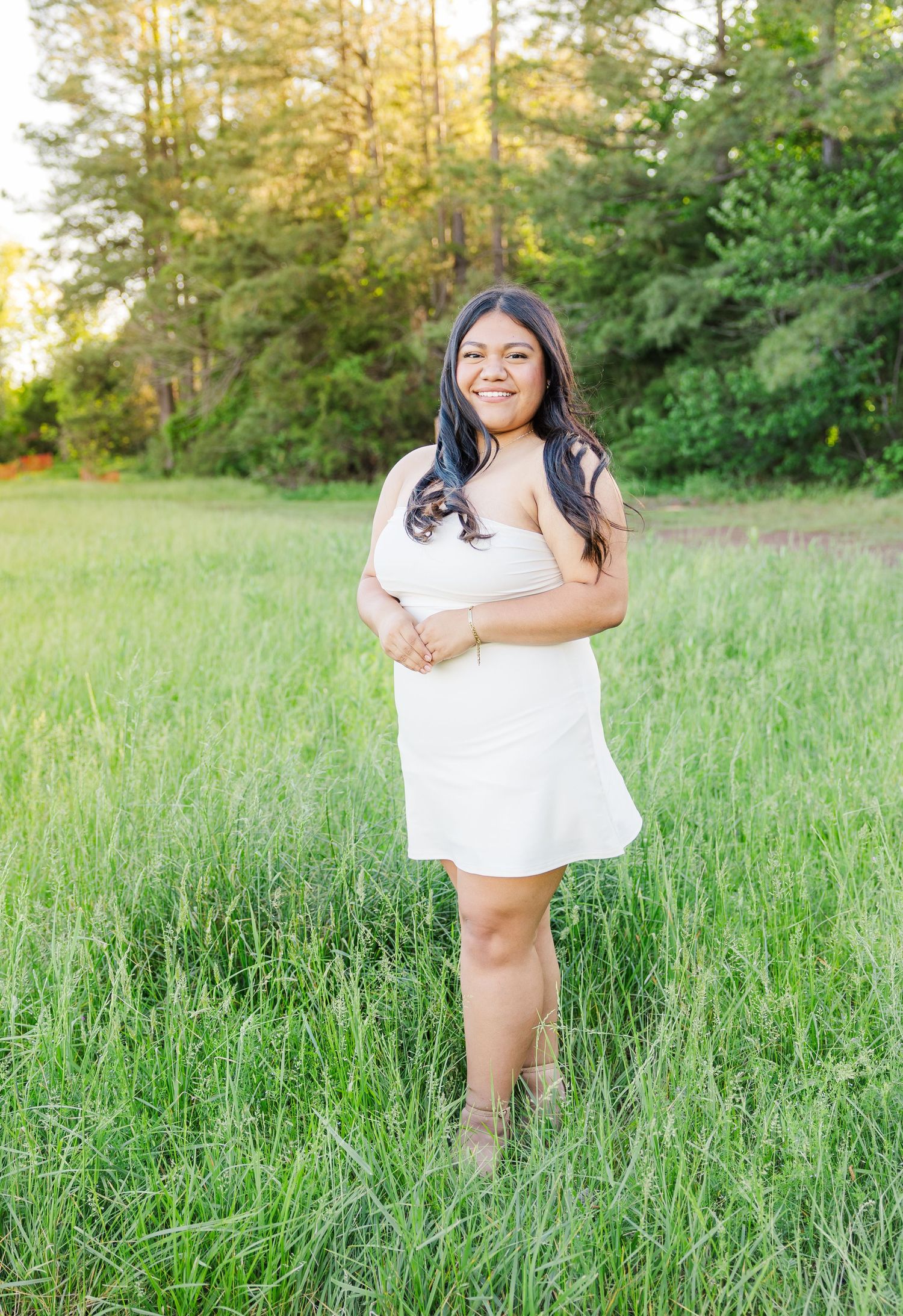 A series of outdoor portrait photos taken in a grassy field during golden hour.