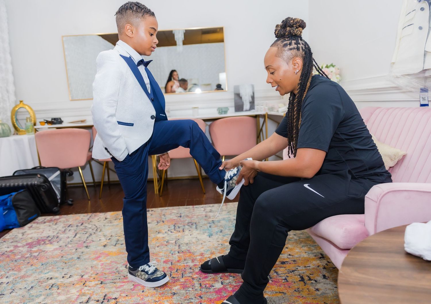 Wedding preparation scene with people in formal attire.