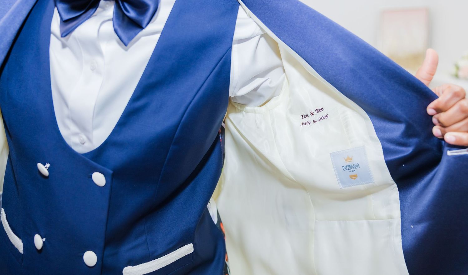 Detail shots of a navy blue vest with white suit combination.